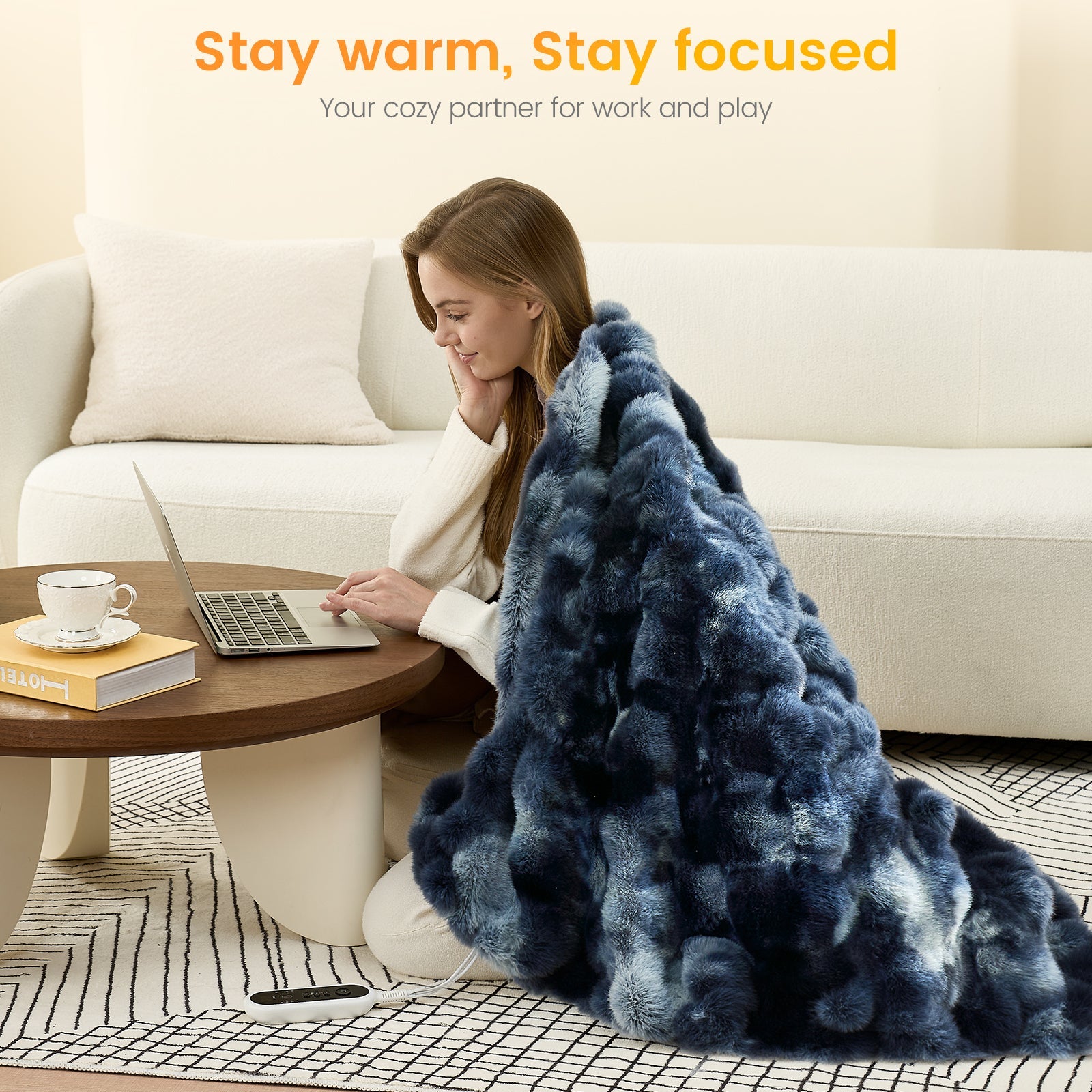 Woman using a laptop with a bubble faux fur electric blanket in Tie-dye Blue, creating a warm and comfortable workspace #color_Tie-dye Blue