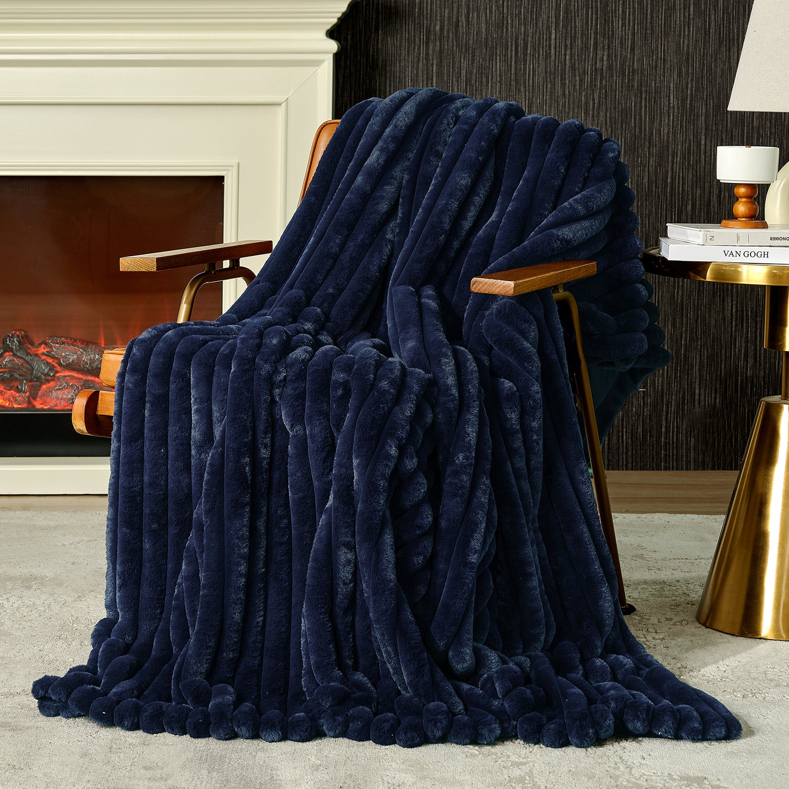 Snuggle Sac striped faux fur throw blanket in Navy Blue draped over a chair near a fireplace, creating a warm and inviting atmosphere #color_Navy Blue
