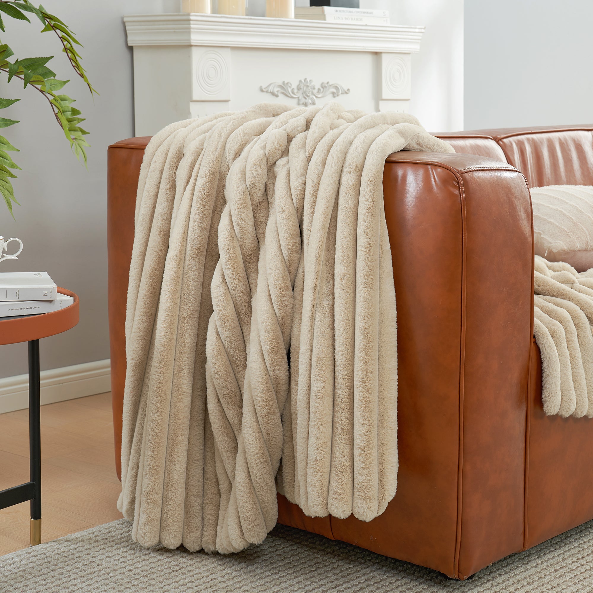 Striped faux fur throw blanket in Beige draped over a sofa, creating a clean and cozy living space #color_Beige
