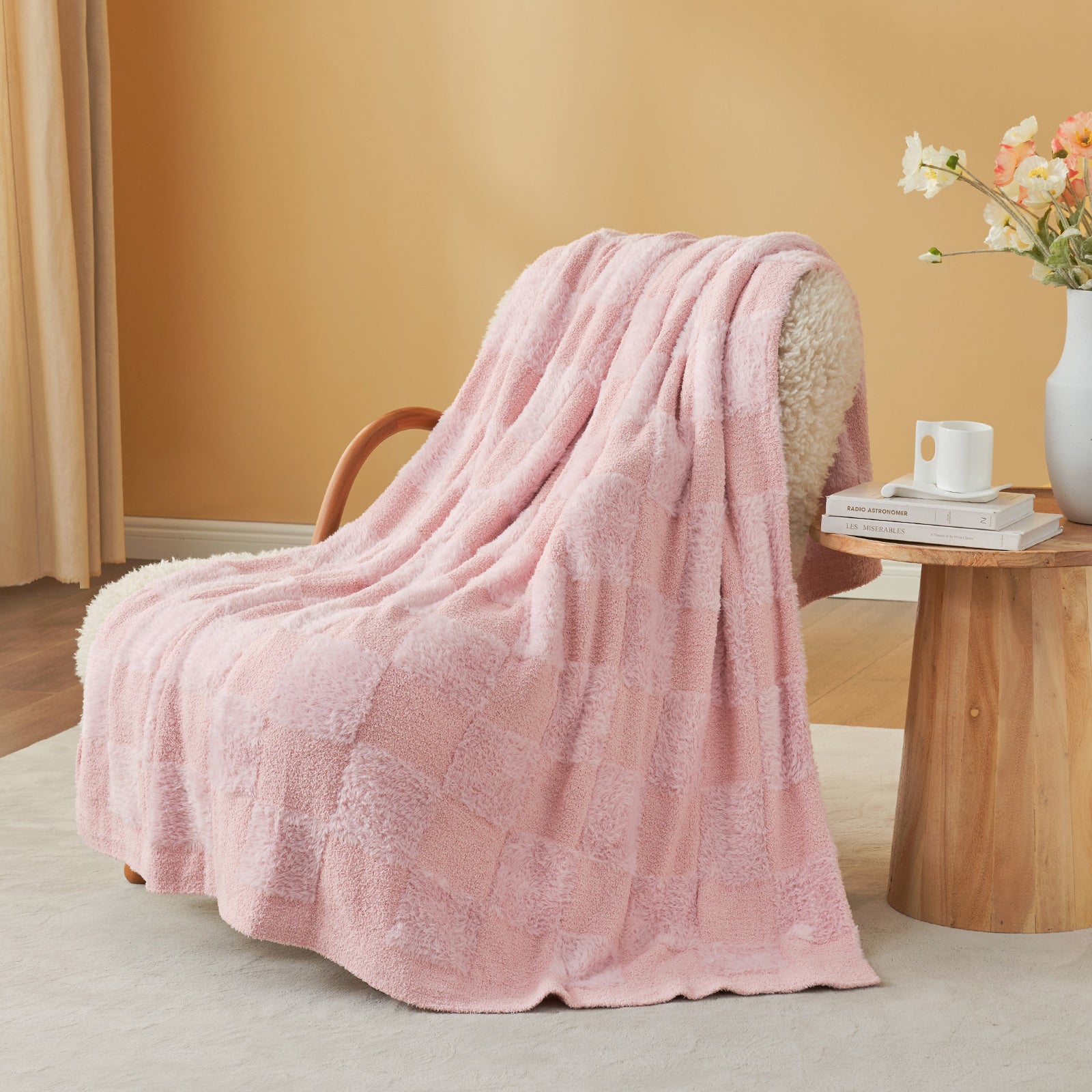 UltraCozy Solid Checkered Feather Yarn Knit Throw Blanket on a beige chair with candle and magazine#Color_Solid Pink