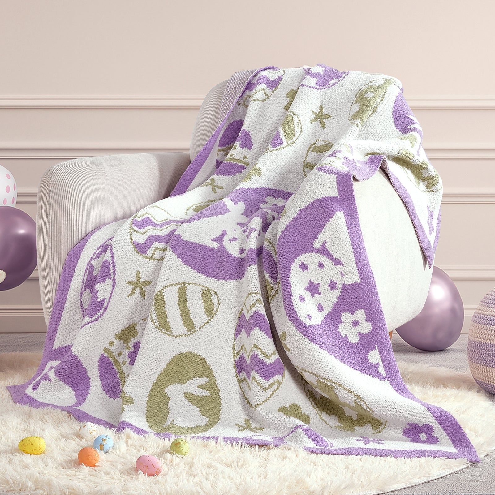 Purple chenille knit throw blanket with bunny and egg pattern draped over an armchair #color_Purple