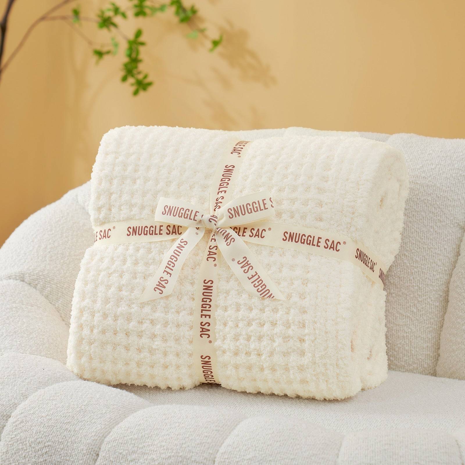 Soft Waffle Feather Yarn Knit Throw Blanket wrapped as a perfecr gift with a ribbon#Color_Cream