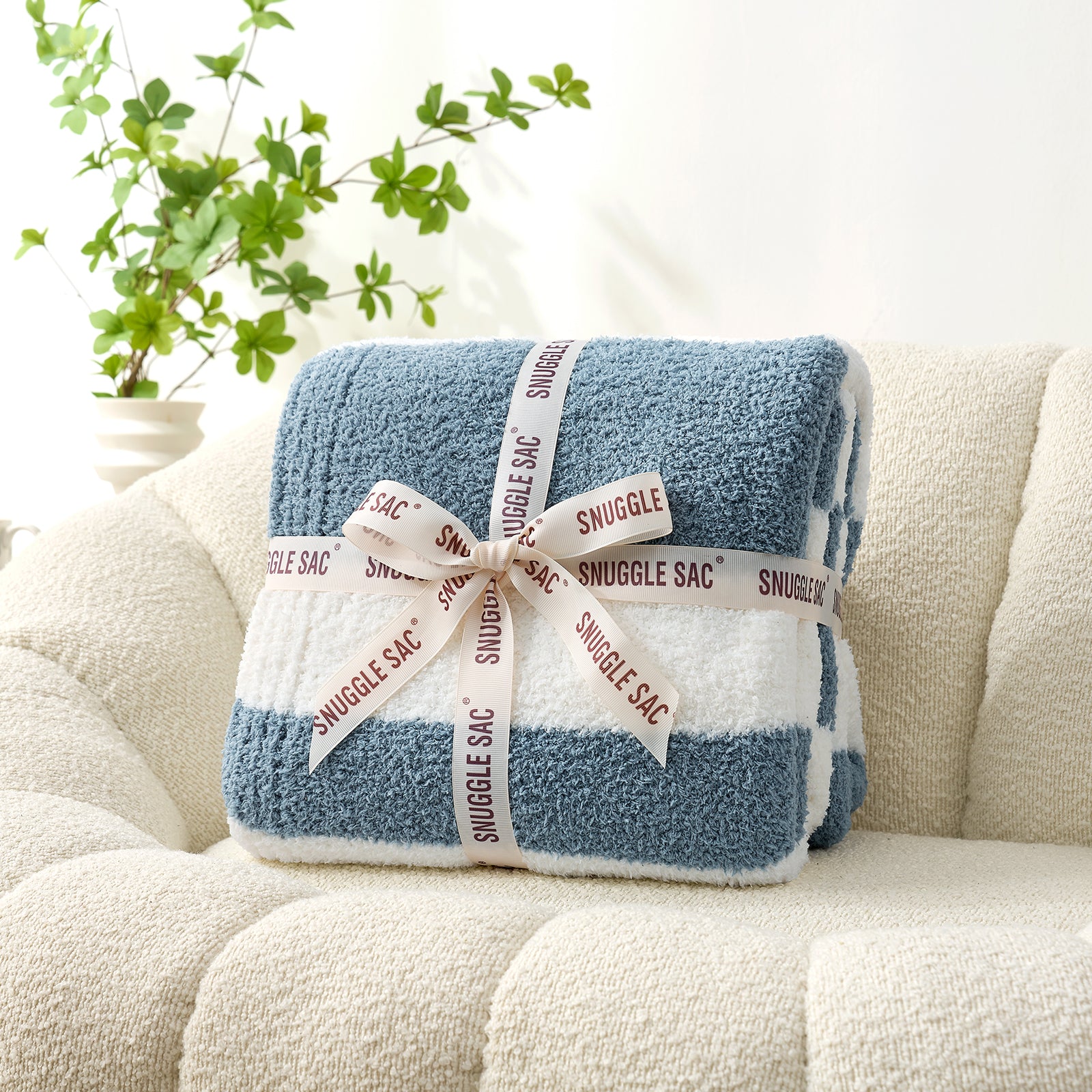 Snuggle Sacs Reversible Blue Striped Feather Yarn Knit Throw Blanket wrapped as a perfect gift with ribbon#color_Blue