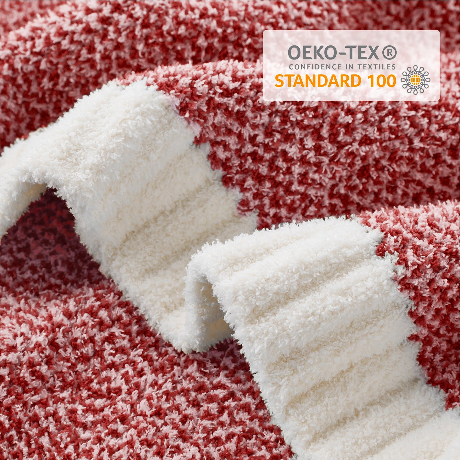 Close up of Snuggle Sac Heather Feather Yarn Heather red Knit Throw Blanket with OEKO-TEX Certificate#color_Heather Red