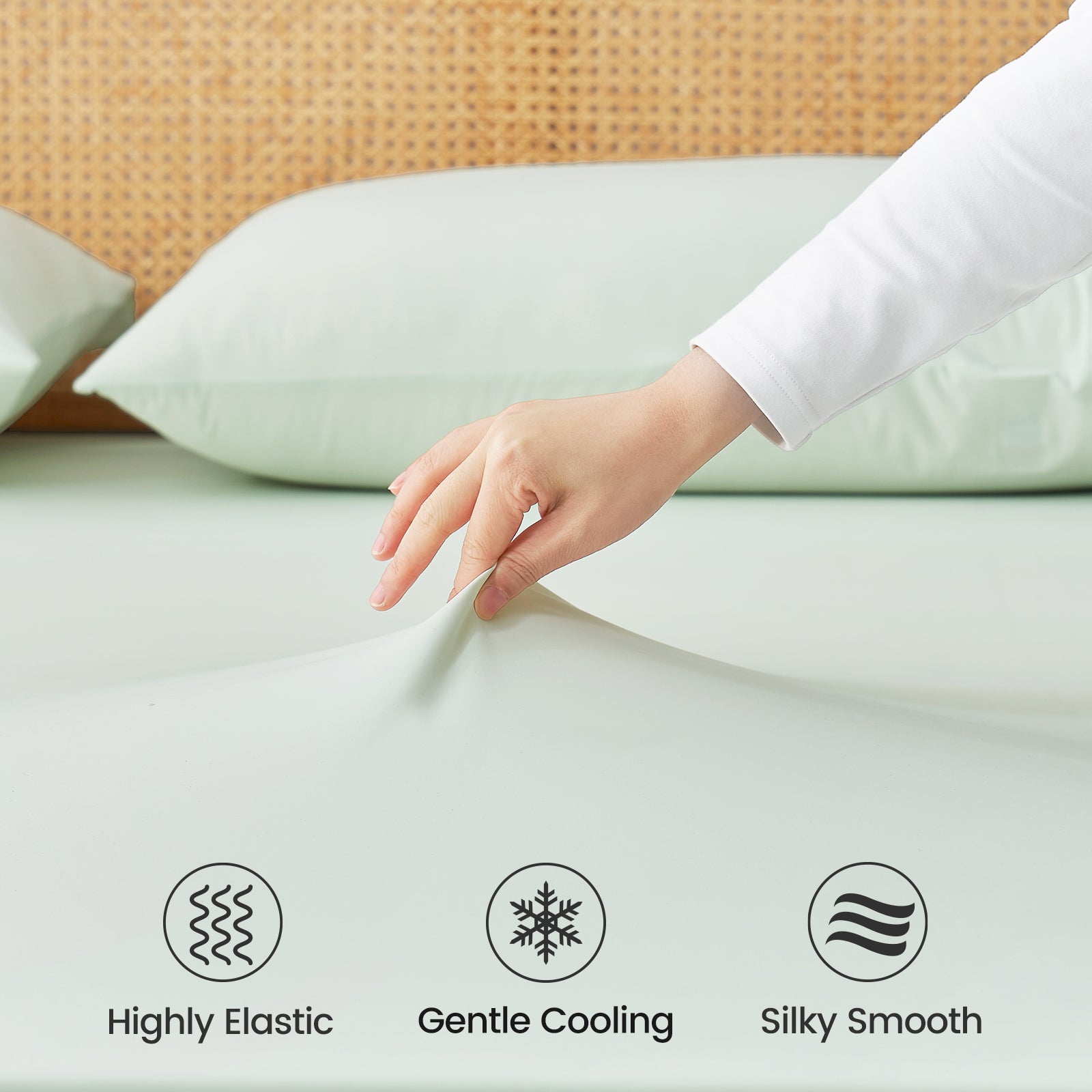 Close up of Snuggle Sac cooling fabric labeled 'Highly Elastic', 'Gentle Cooling', and 'Silky Smooth'.#color_Mint Green