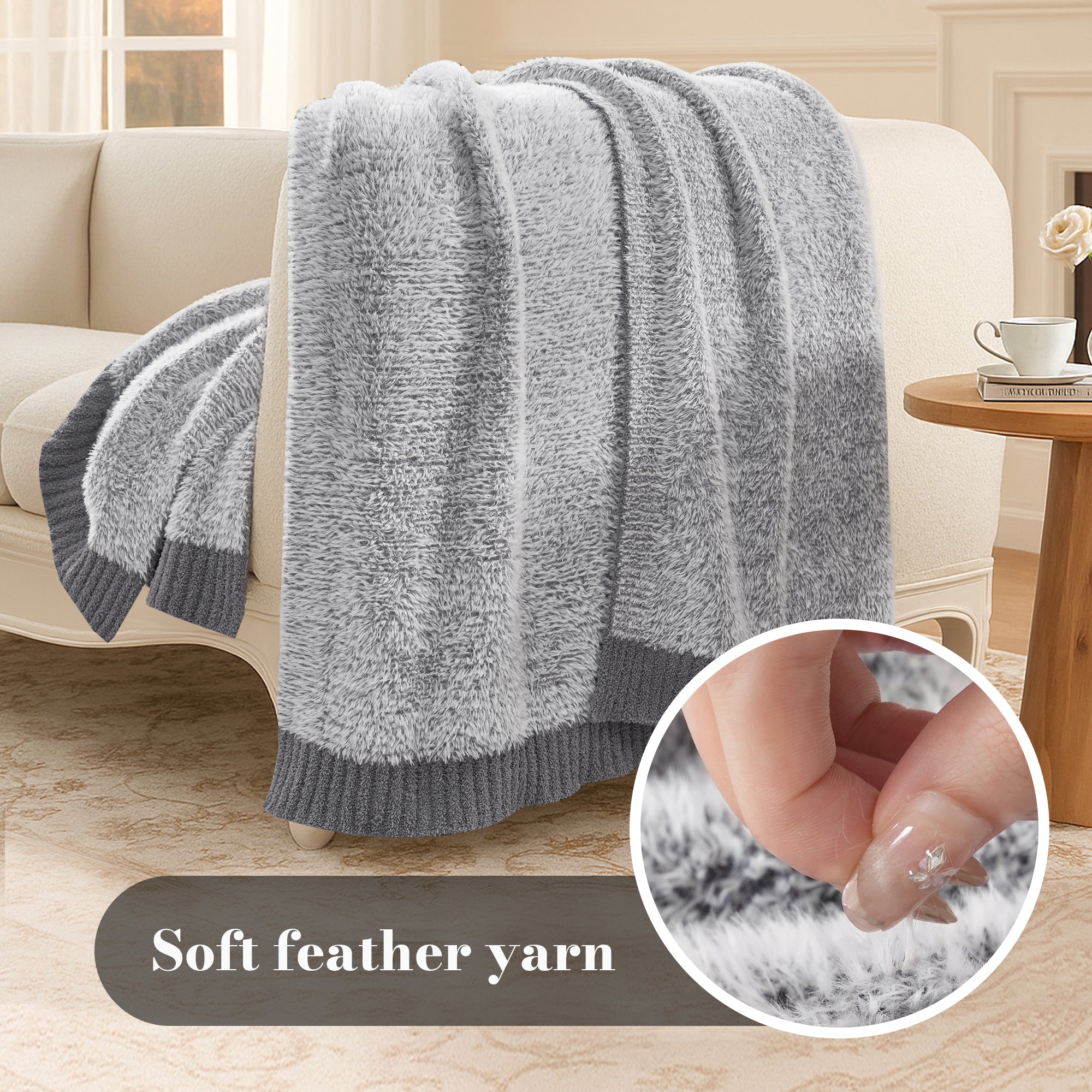 Ultrasoft faux fur knit throw blanket in Gray displayed on sofa, highlighting soft feather yarn texture #color_Gray