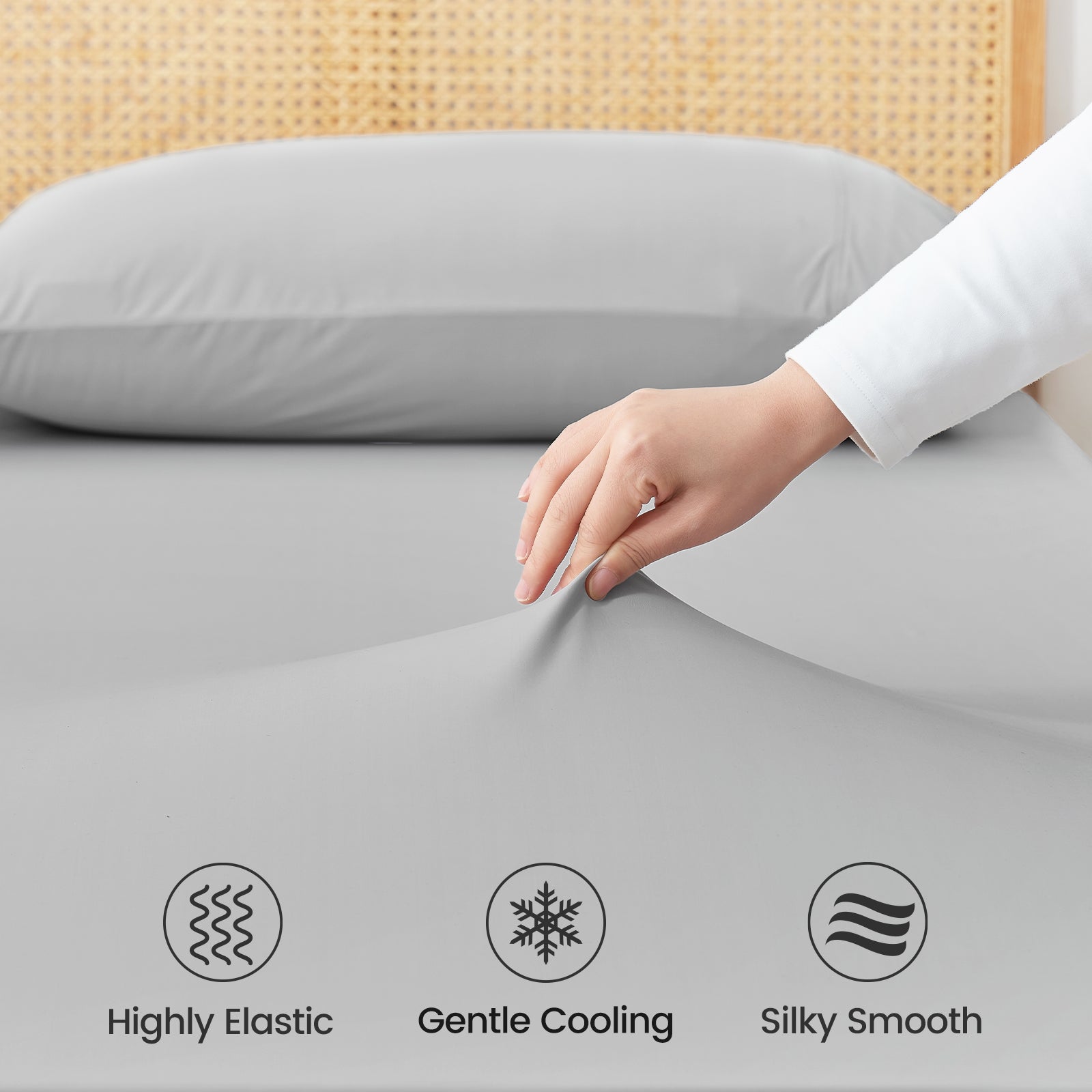 Close up of Snuggle Sac cooling fabric labeled 'Highly Elastic', 'Gentle Cooling', and 'Silky Smooth'.#color_Light Grey