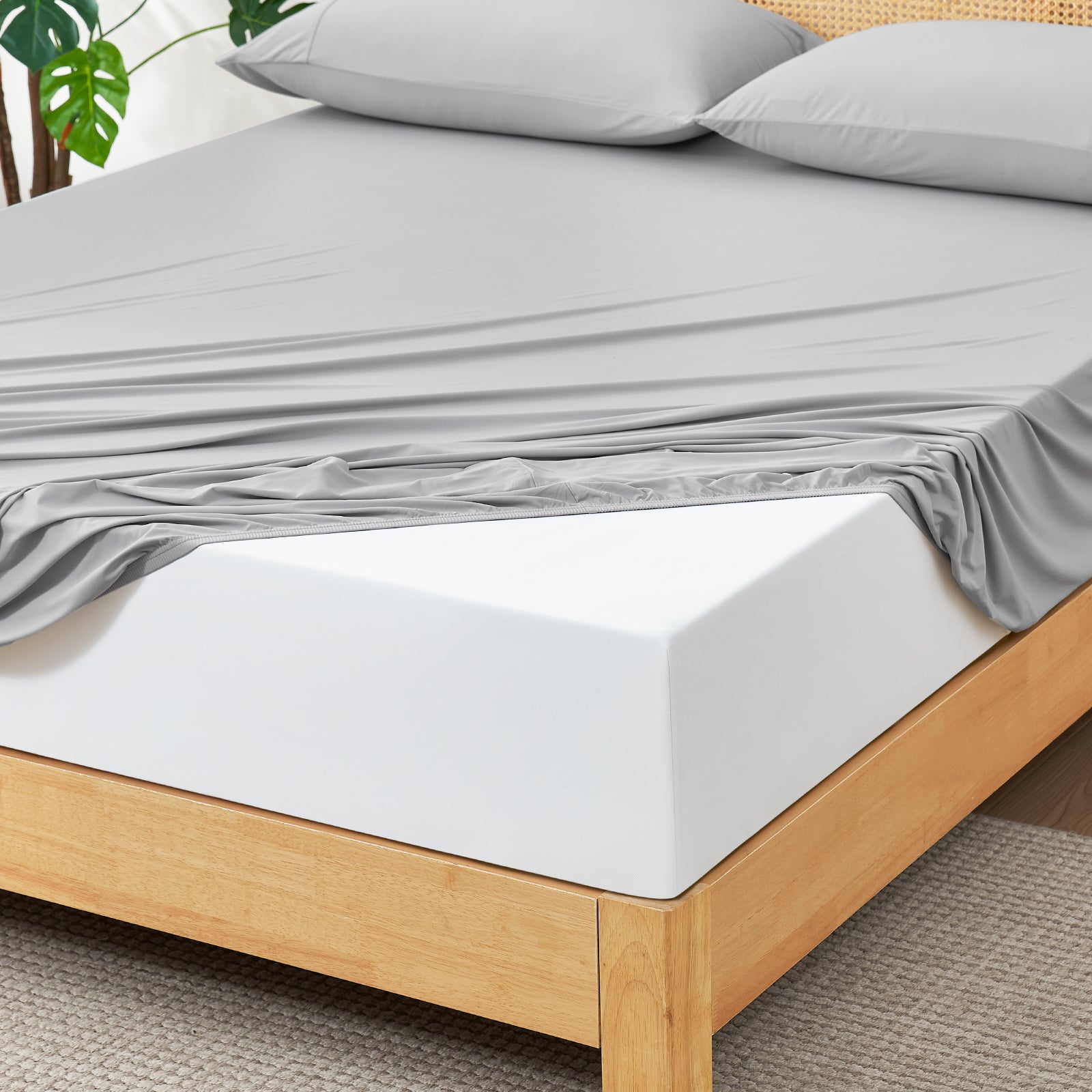 Light Grey fitted sheet set on wooden bed.#color_Light Grey