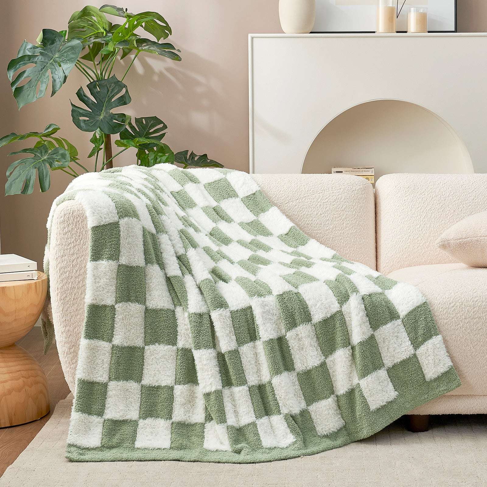 UltraCozy Checkered Feather Yarn Knit Throw Blanket on a beige couch #Color_Sage Green White