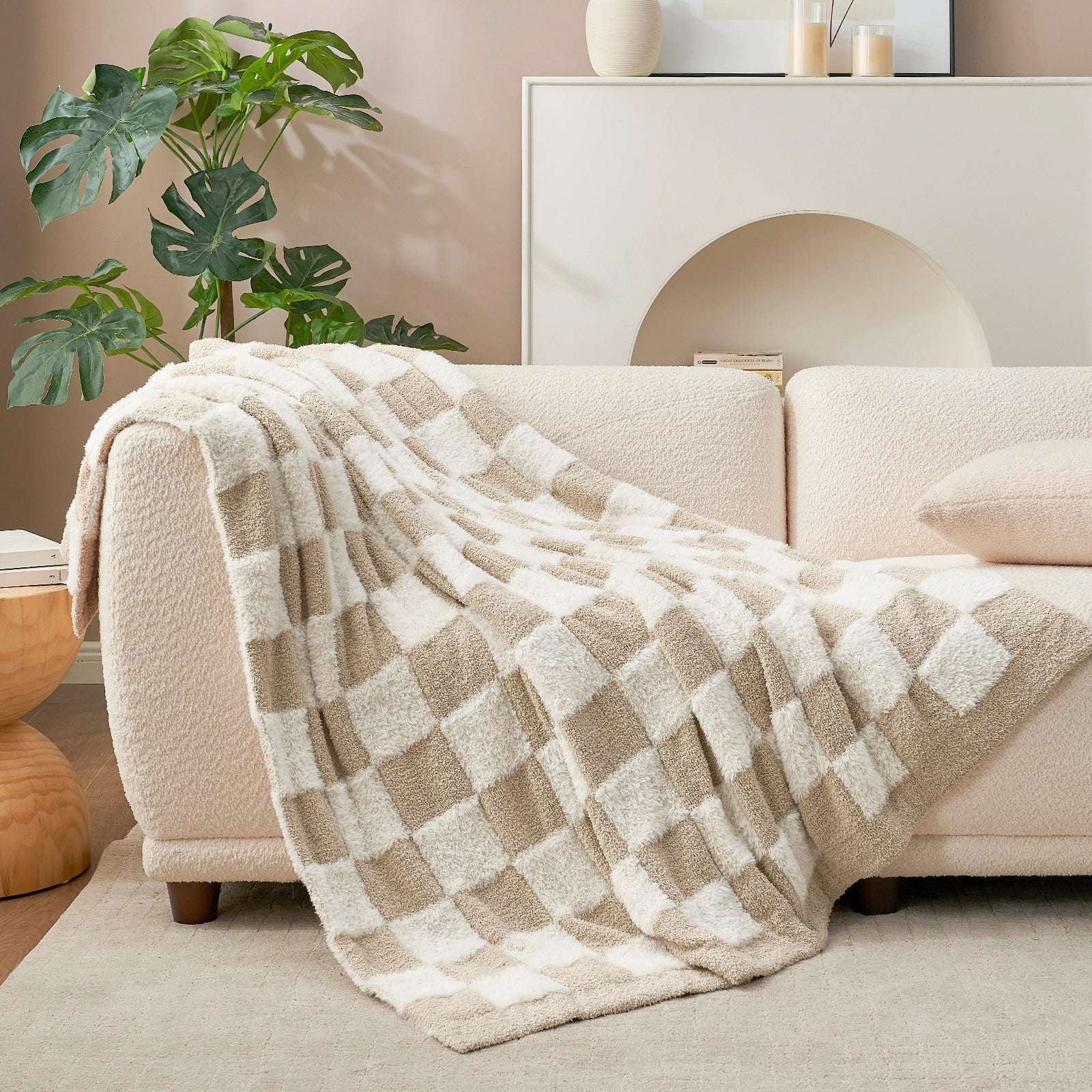 UltraCozy Checkered Feather Yarn Knit Throw Blanket on a beige couch #Color_Beige White