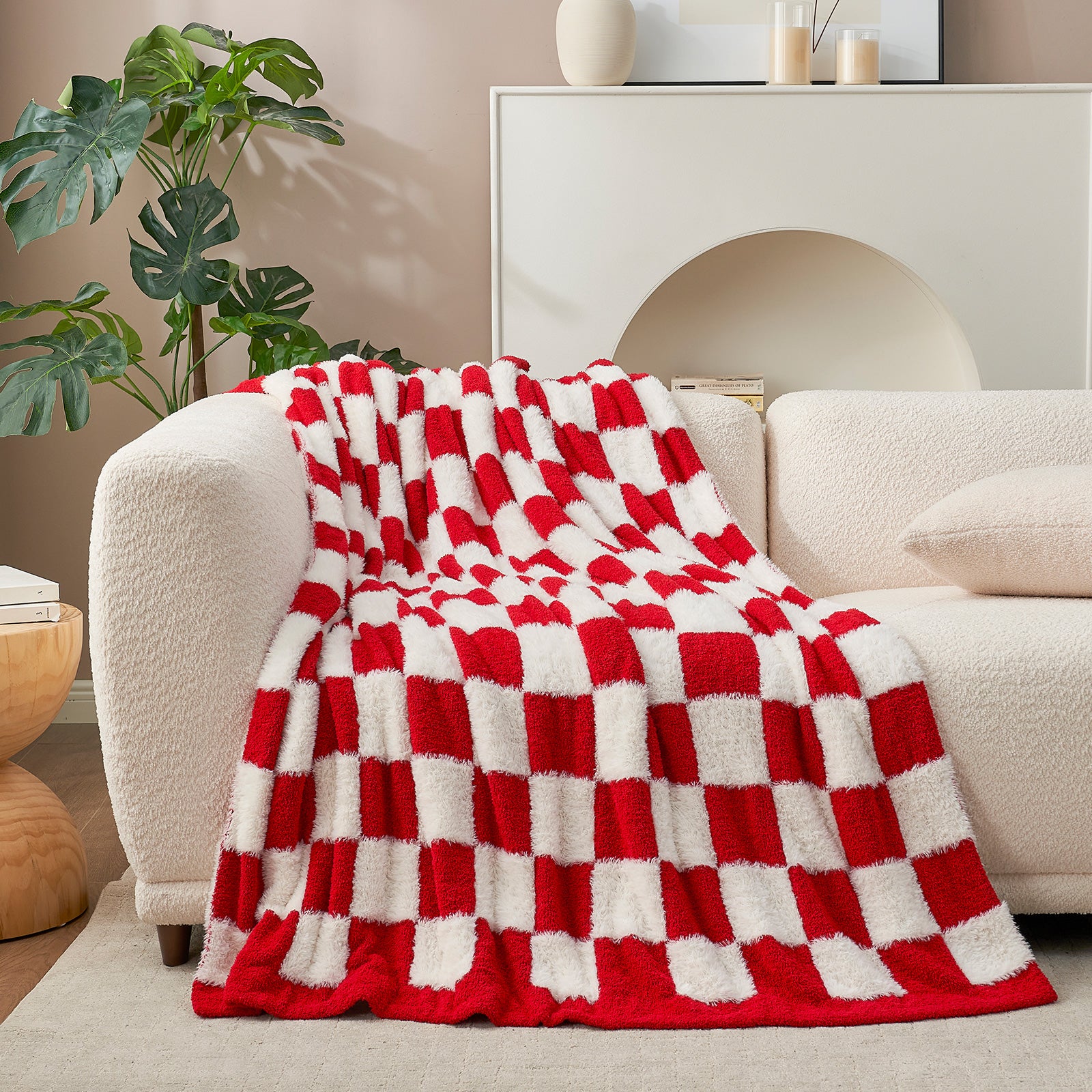 UltraCozy Checkered Feather Yarn Knit Throw Blanket on a beige couch #Color_Red/Cream