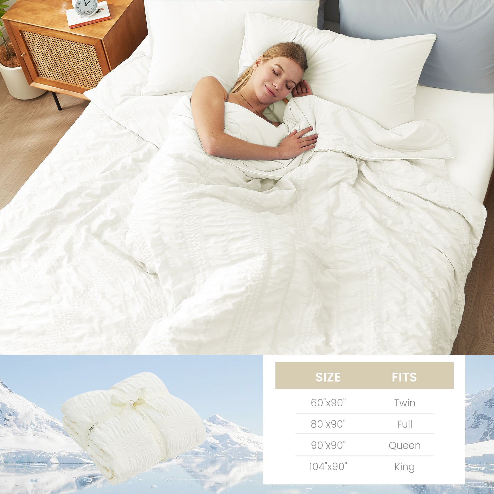 A woman laying down on the bed with Snuggle Sac Cooling comforter #color_White