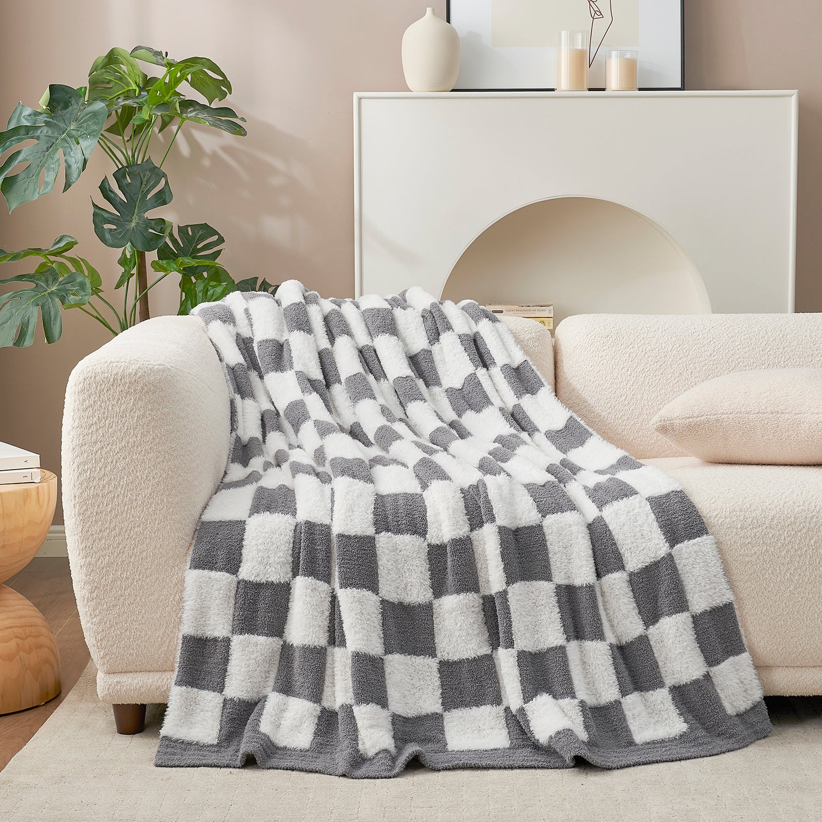 UltraCozy Checkered Feather Yarn Knit Throw Blanket on a beige couch #Color_Grey White