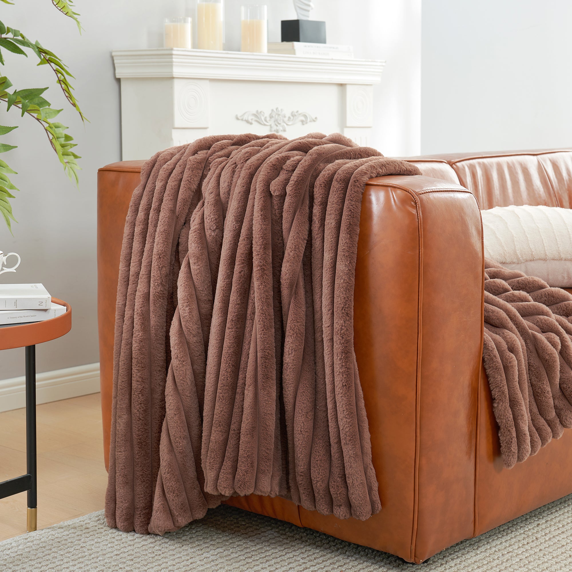 Striped faux fur throw blanket in Light coffee draped over a sofa, creating a clean and cozy living space #color_Light coffee