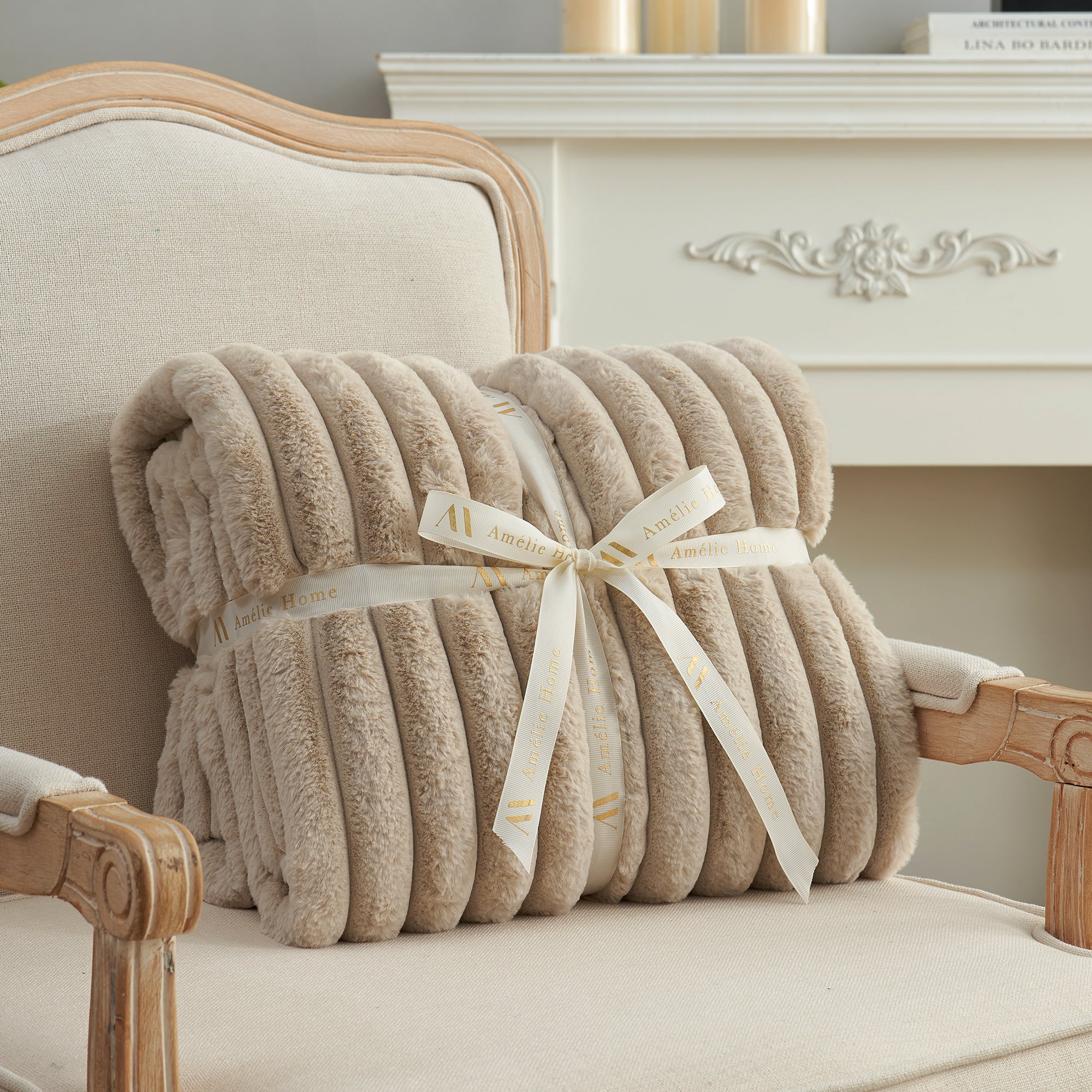 Striped faux fur throw blanket in Beige folded with ribbon, perfect for gifting #color_Beige