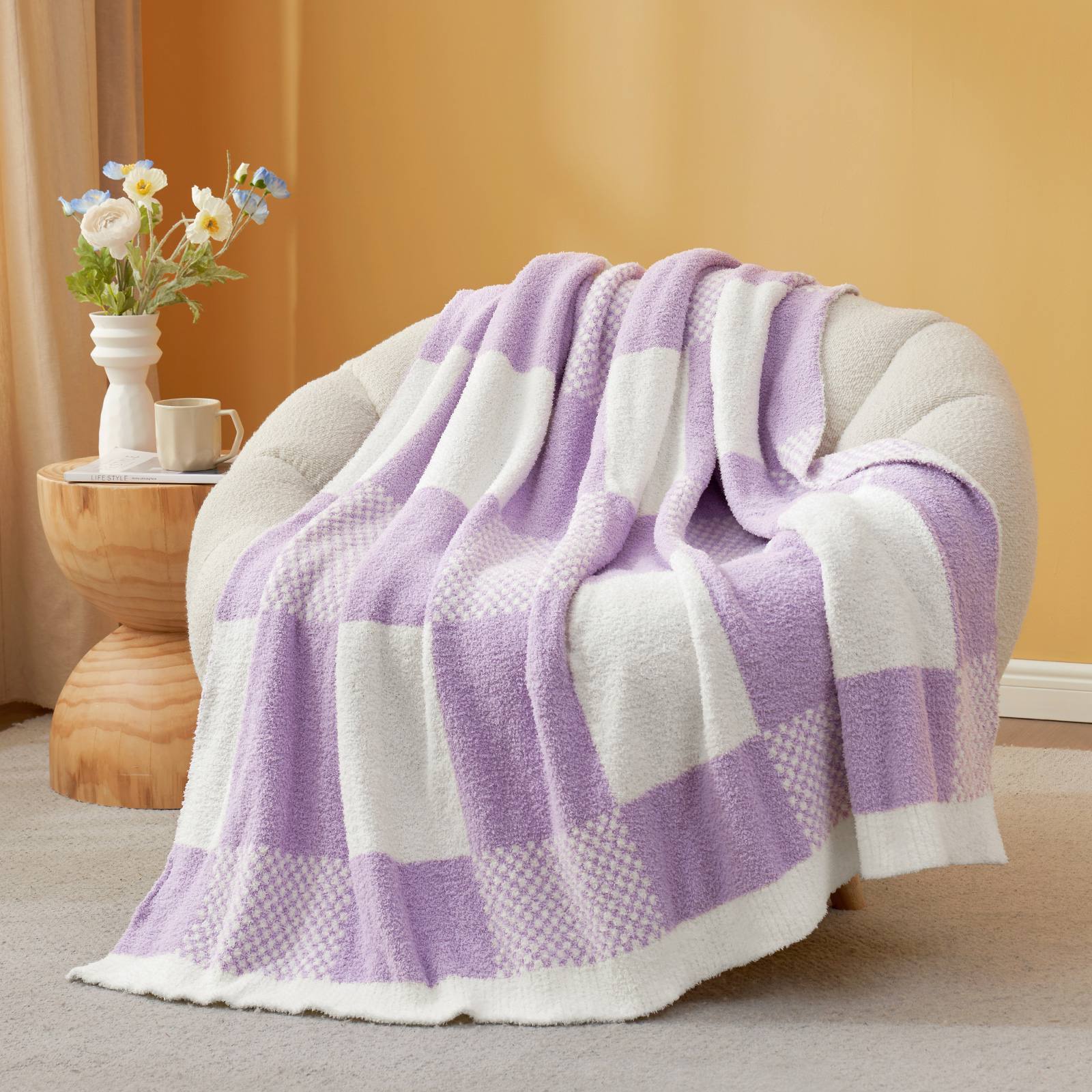Snuggle Sac Checkered Feather Yarn Knit Throw Blanket on the chair with furnitures behind#color_Lilac