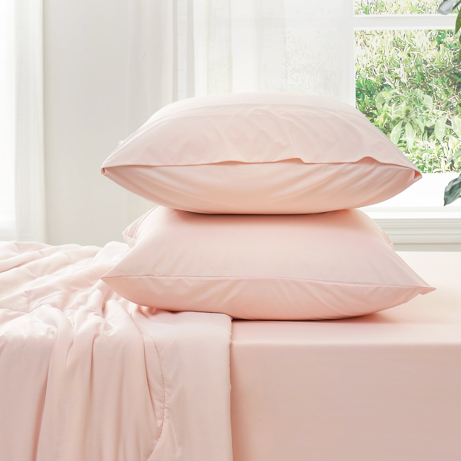 Side view of Snuggle Sac cooling fitted sheet and pillowcase set#color_Pink