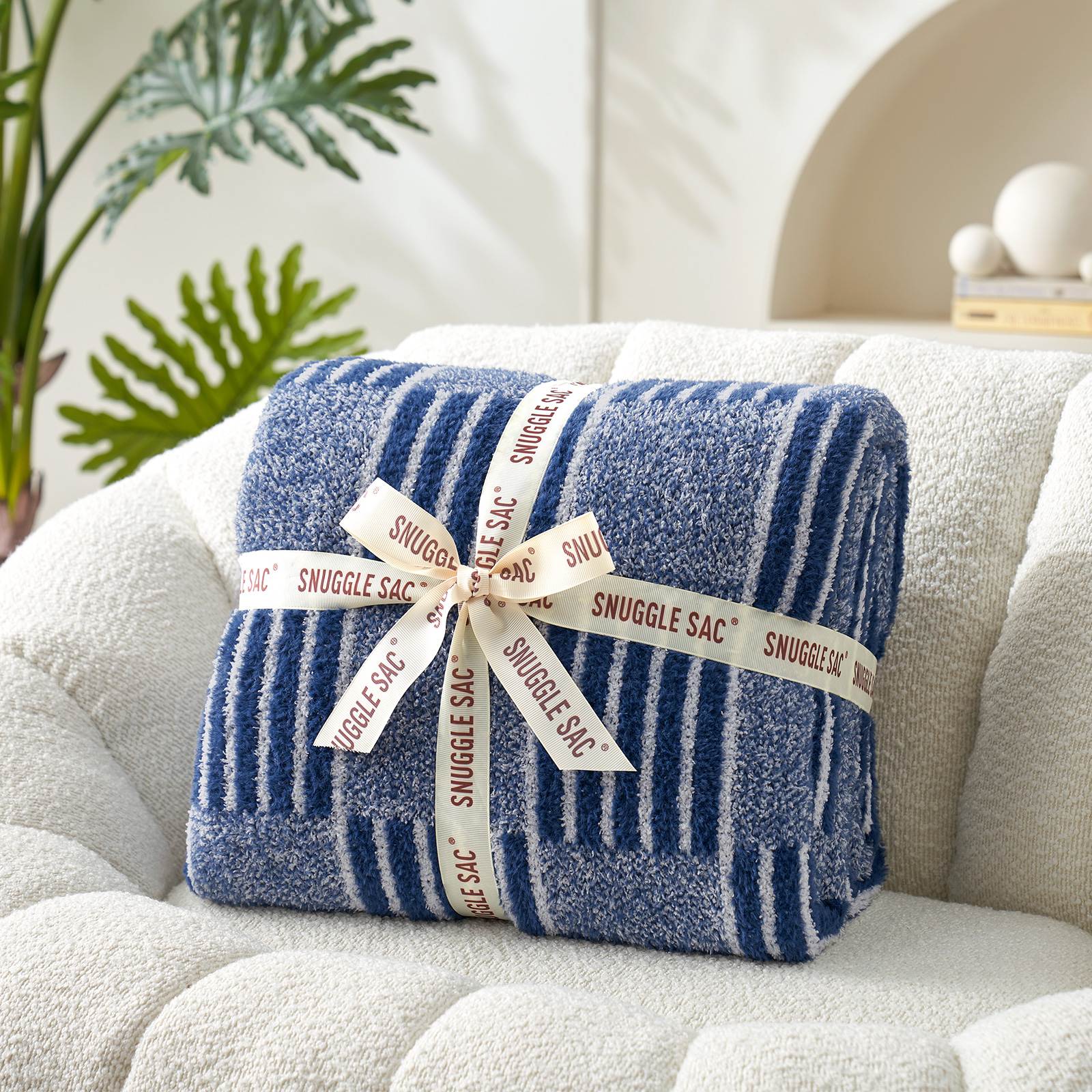Snuggle Sacs Reversible Heather Checkered Feather Yarn Knit Throw Blanket wrapped as a pefect gift with ribbon#Color_Heather Navy