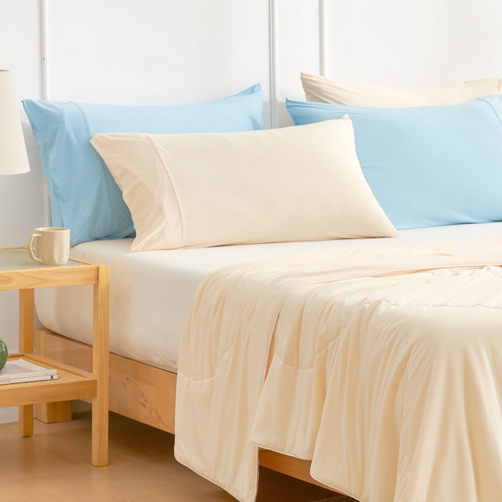 Snuggle Sac Pillowcases on bedding in a bedroom setting#Color_Yellow
