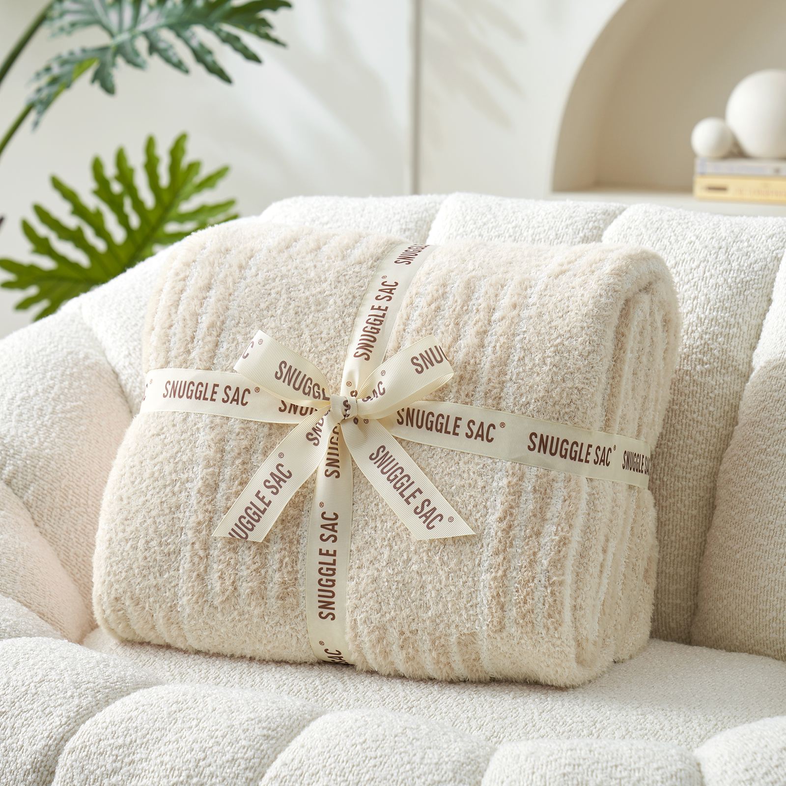 Snuggle Sacs Reversible Heather Checkered Feather Yarn Knit Throw Blanket wrapped as a pefect gift with ribbon#Color_Heather Cream