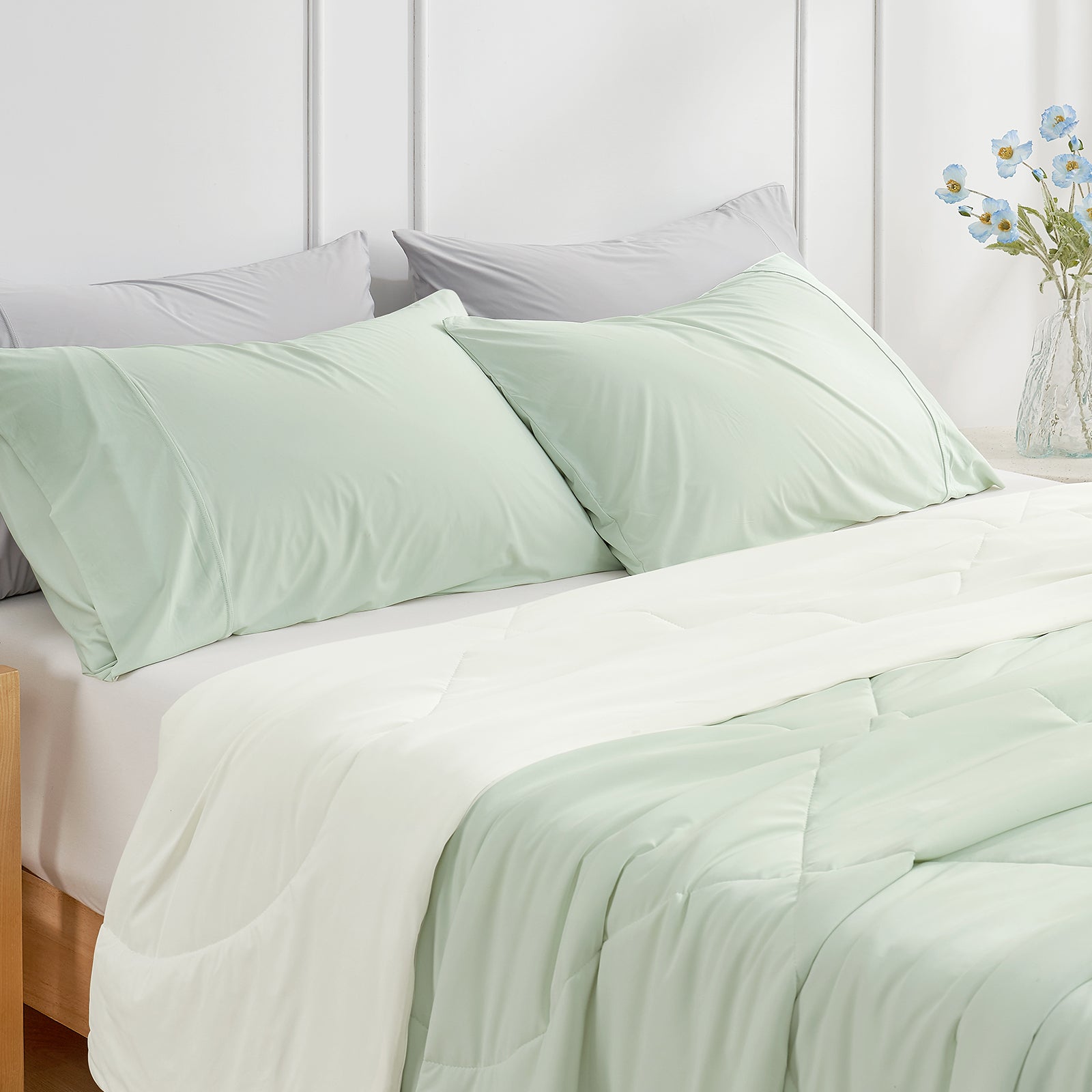 Snuggle Sac Pillowcases on bedding in a bedroom setting#Color_Green