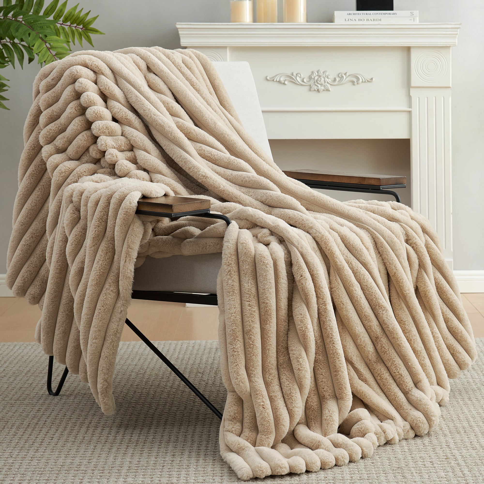 Snuggle Sac striped faux fur throw blanket in Beige draped over a chair near a fireplace, creating a warm and inviting atmosphere #color_Beige
