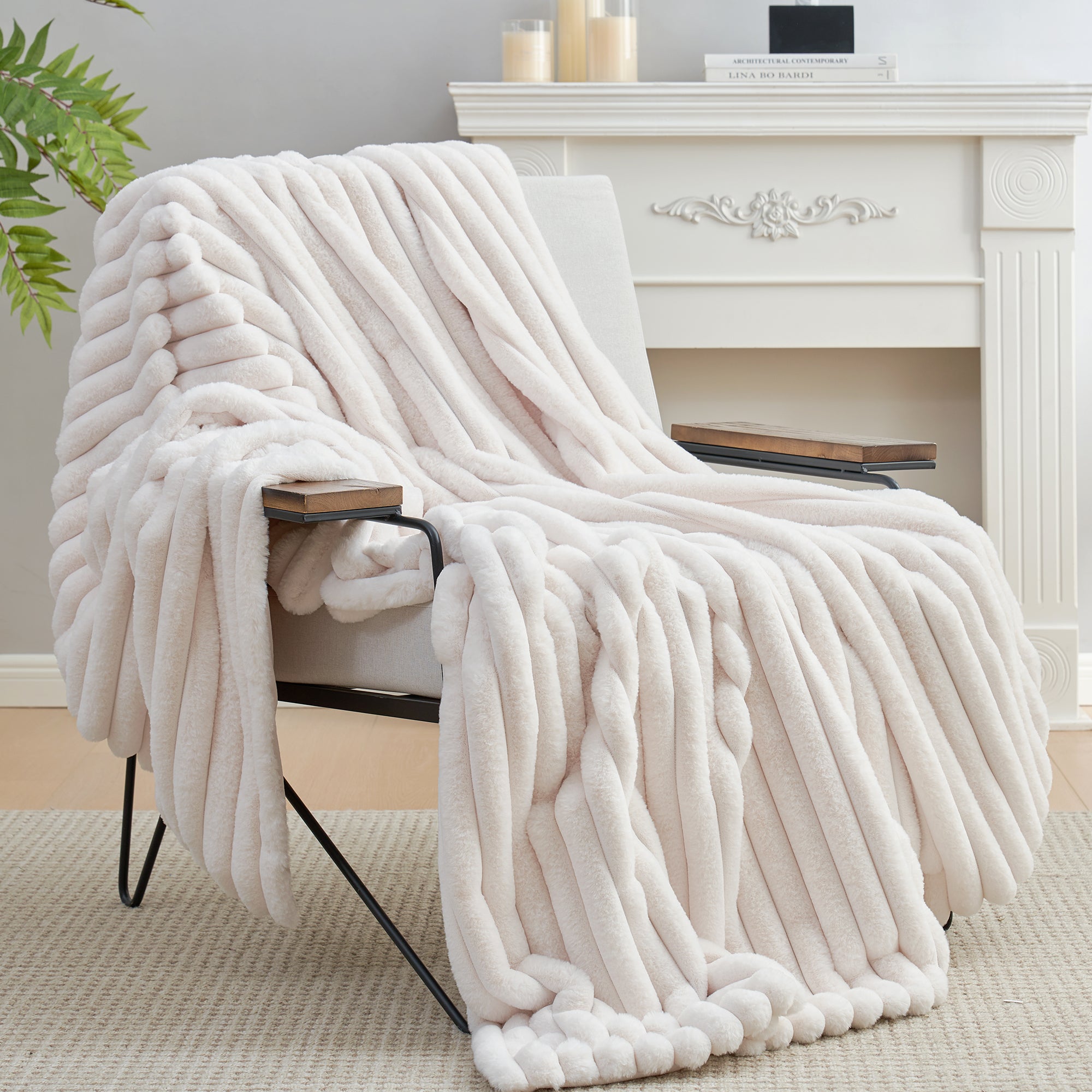 Striped faux fur throw blanket in Ivory draped over a chair, creating a clean and cozy living space #color_Ivory