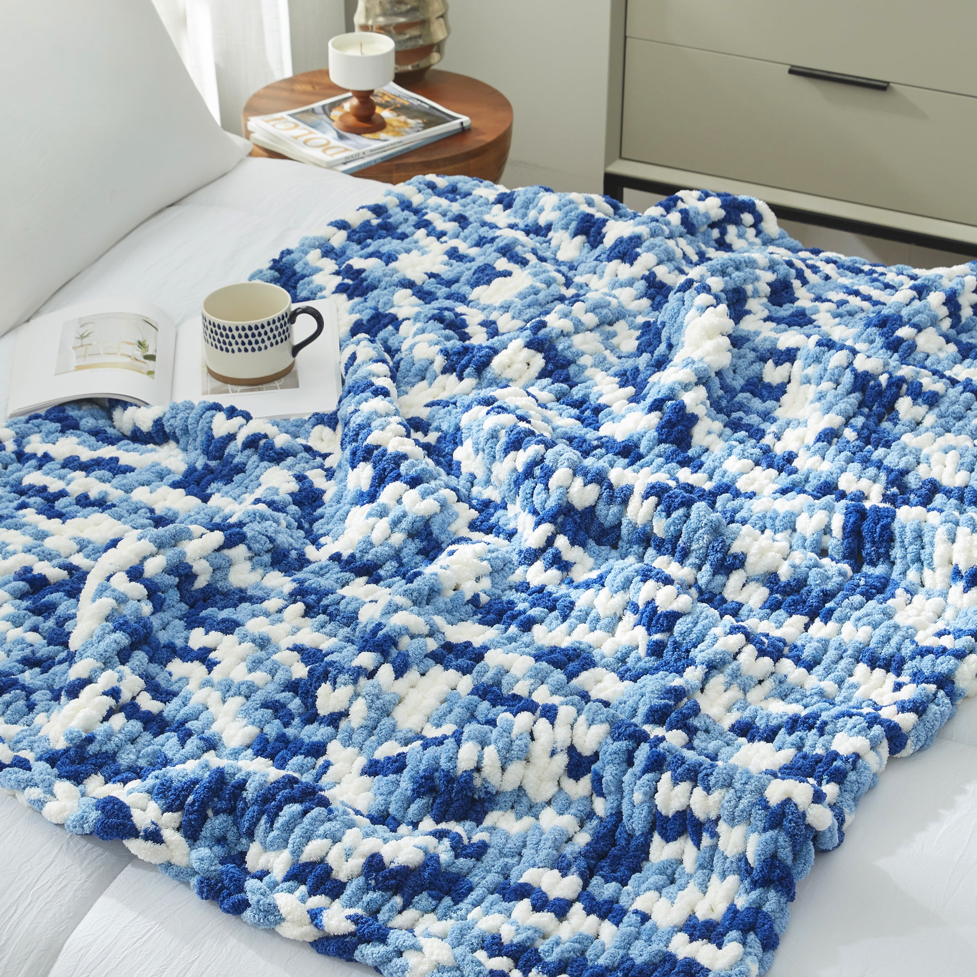 Close up of chunky chenille knit throw blanket in Blue laid flat showcasing plush texture #color_Blue