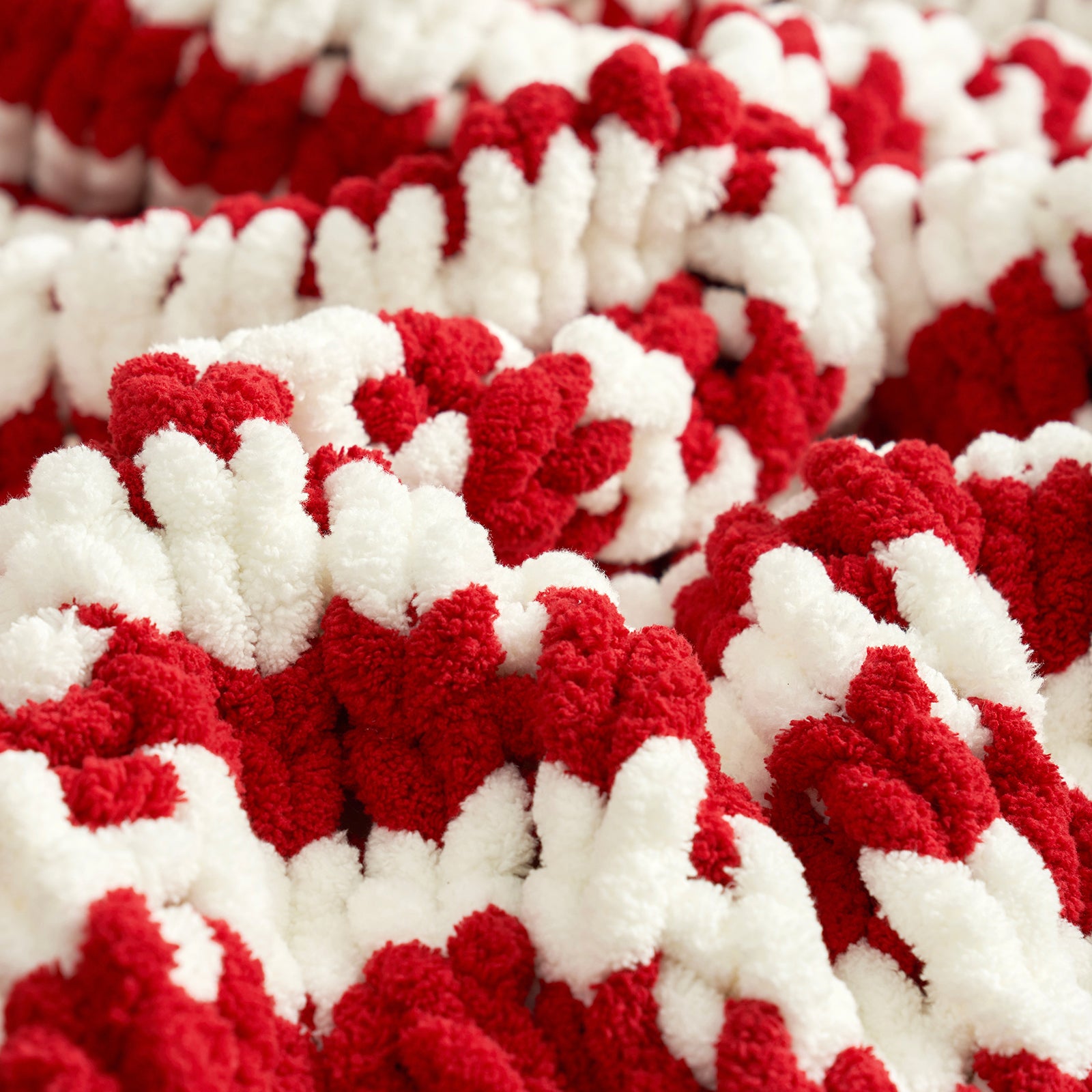 Close up of chunky chenille knit throw blanket in Red Stripe laid flat showcasing plush texture #color_Red Stripe
