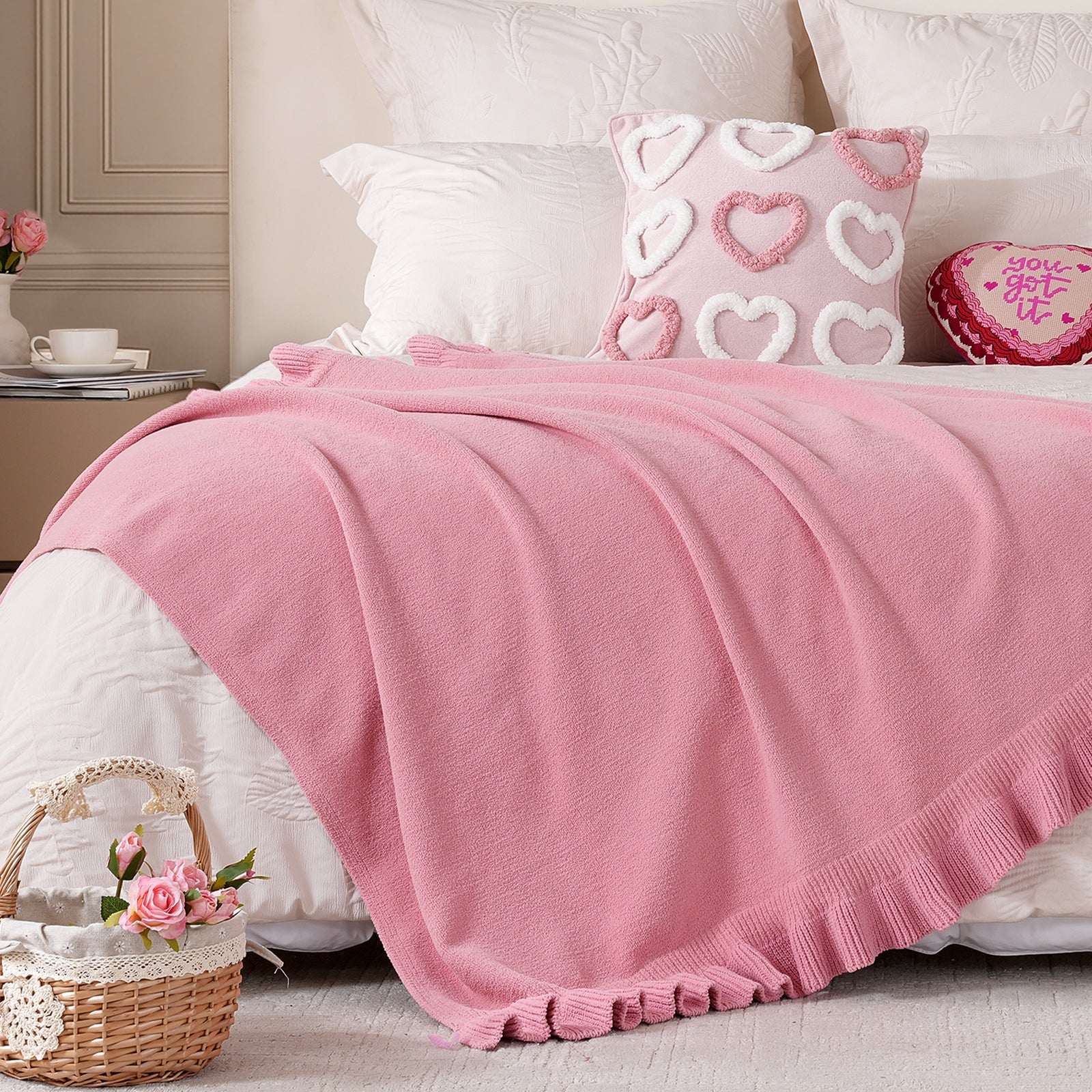 Ruffle chenille knit throw blanket in Pink layered on bed, creating a cozy and romantic bedroom atmosphere #color_Pink