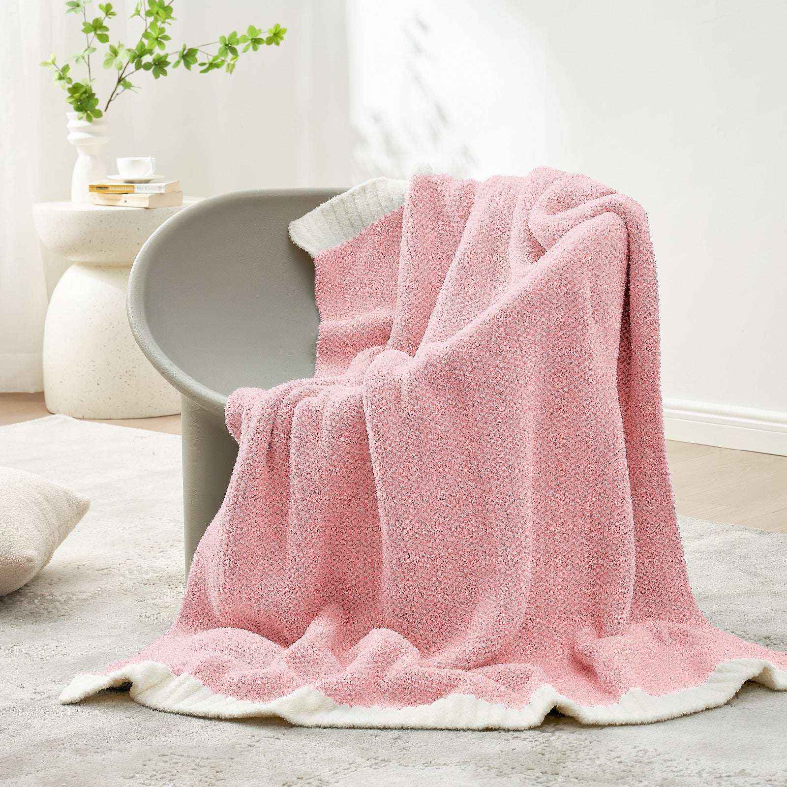 Snuggle Sac Heather Feather Yarn Pink Knit Throw Blanket on the chair#Color_Pink