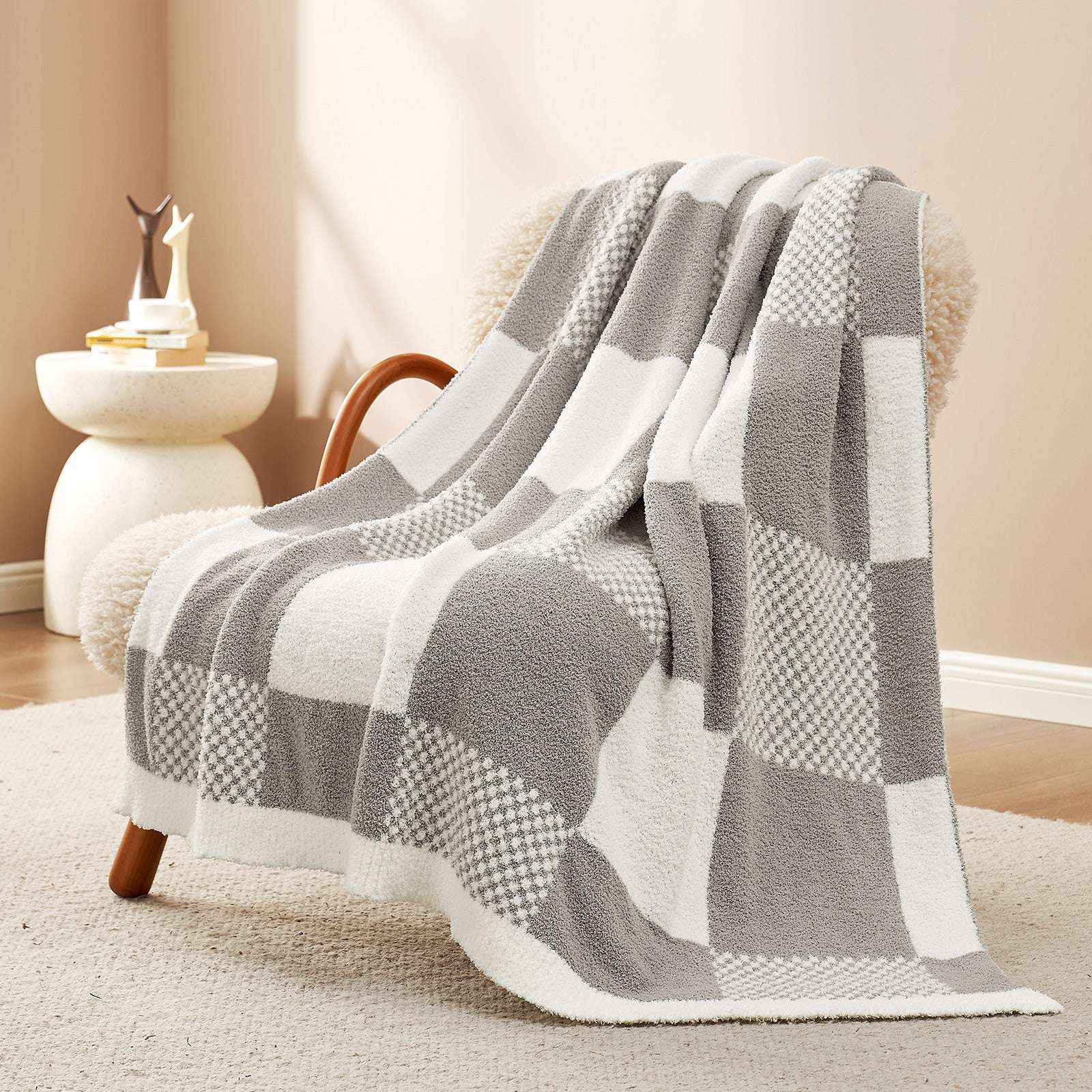 Snuggle Sac Checkered Feather Yarn Knit Throw Blanket on the chair with furnitures behind#Color_Grey