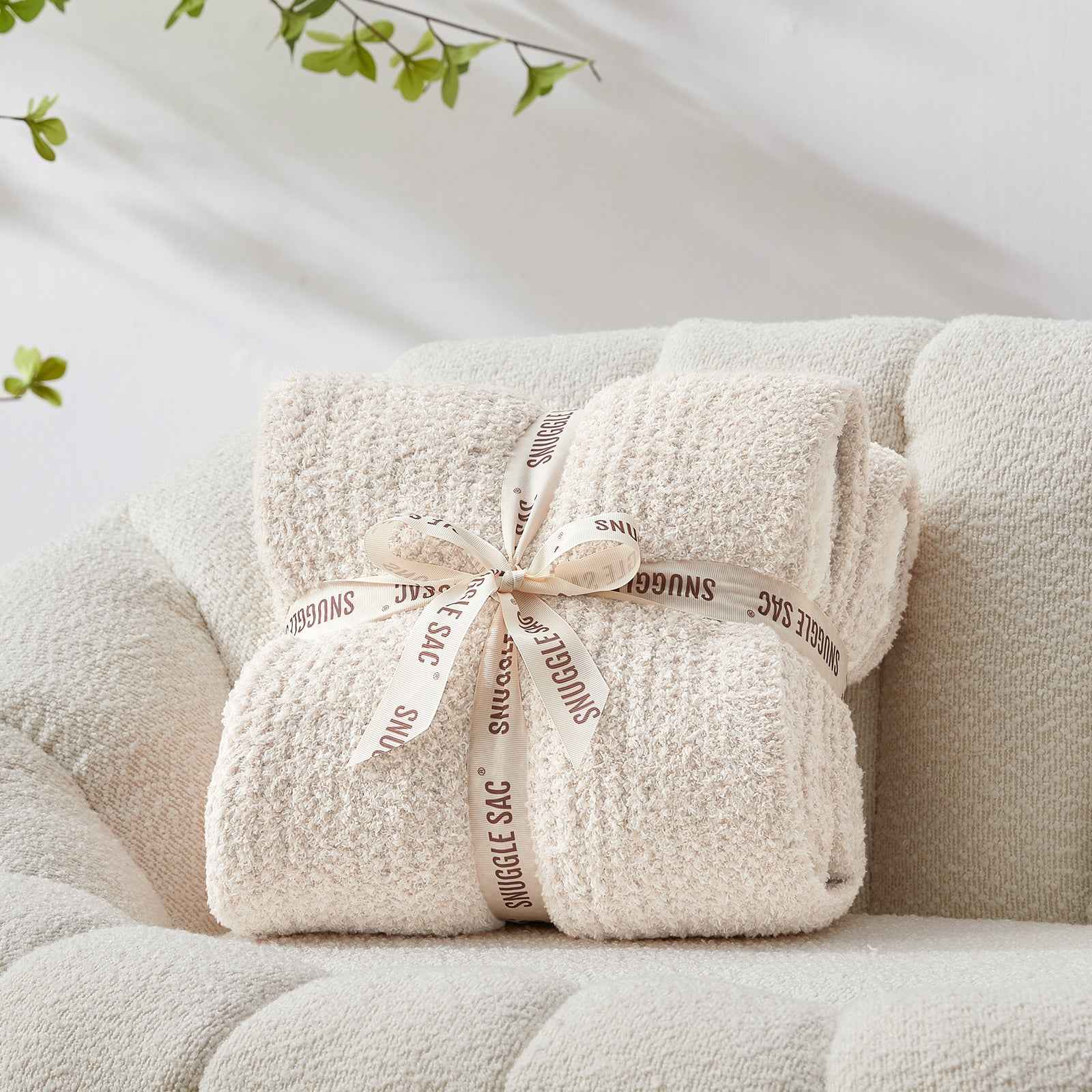 Snuggle Sac Heather Feather Yarn Ivory Knit Throw Blanket wrapped as a perfect gift for people #Color_Ivory