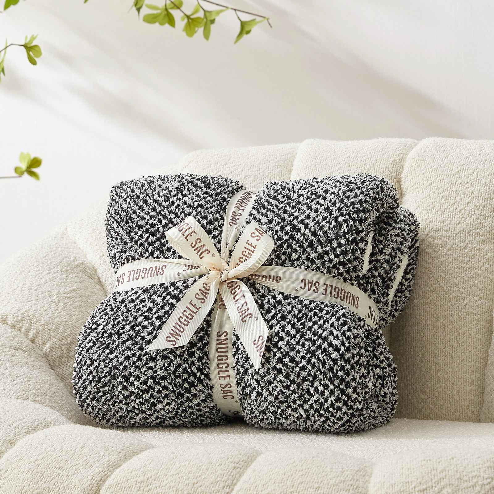 Snuggle Sac Heather Feather Yarn Black Knit Throw Blanket wrapped as a perfect gift for people#Color_Black