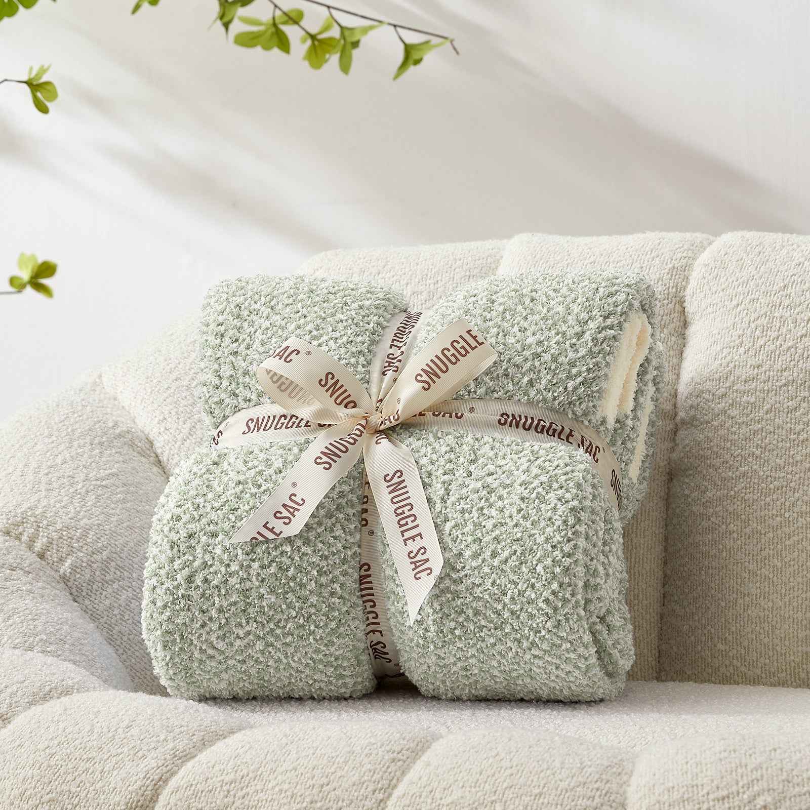 Snuggle Sac Heather Feather Yarn Sage Green Knit Throw Blanket wrapped as a perfect gift for people#Color_Sage Green