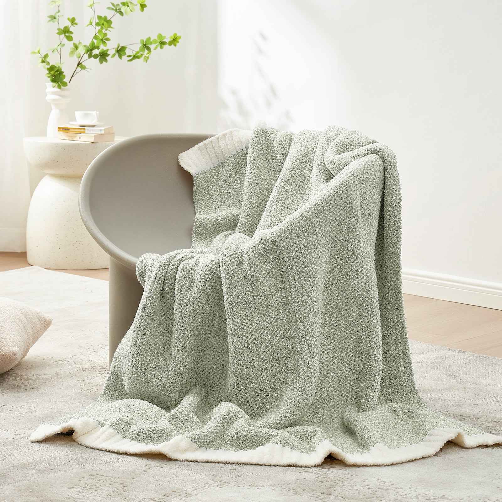 Snuggle Sac Heather Feather Yarn sage green Knit Throw Blanket on the chair#Color_Sage Green