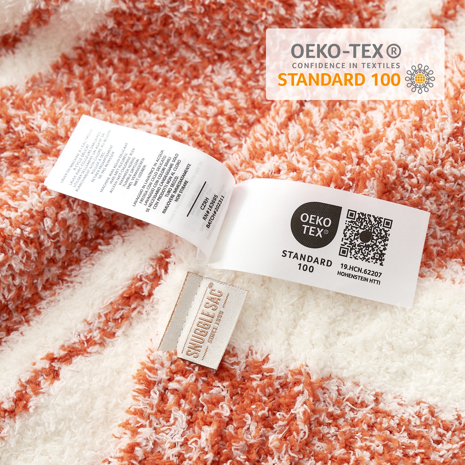 Close up of Striped Feather Yarn Knit Throw Blanket showing OEKO-TEX Certificate#Color_Orange