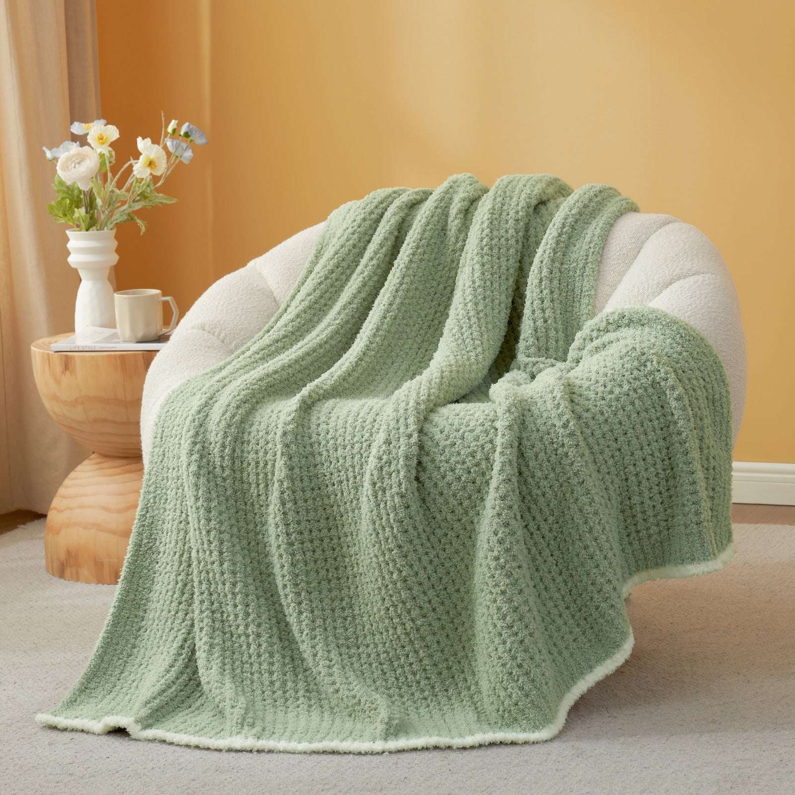  Soft Waffle Feather Yarn Knit Throw Blanket on a beige chair with vase of flower and mug#Color_Sage Green