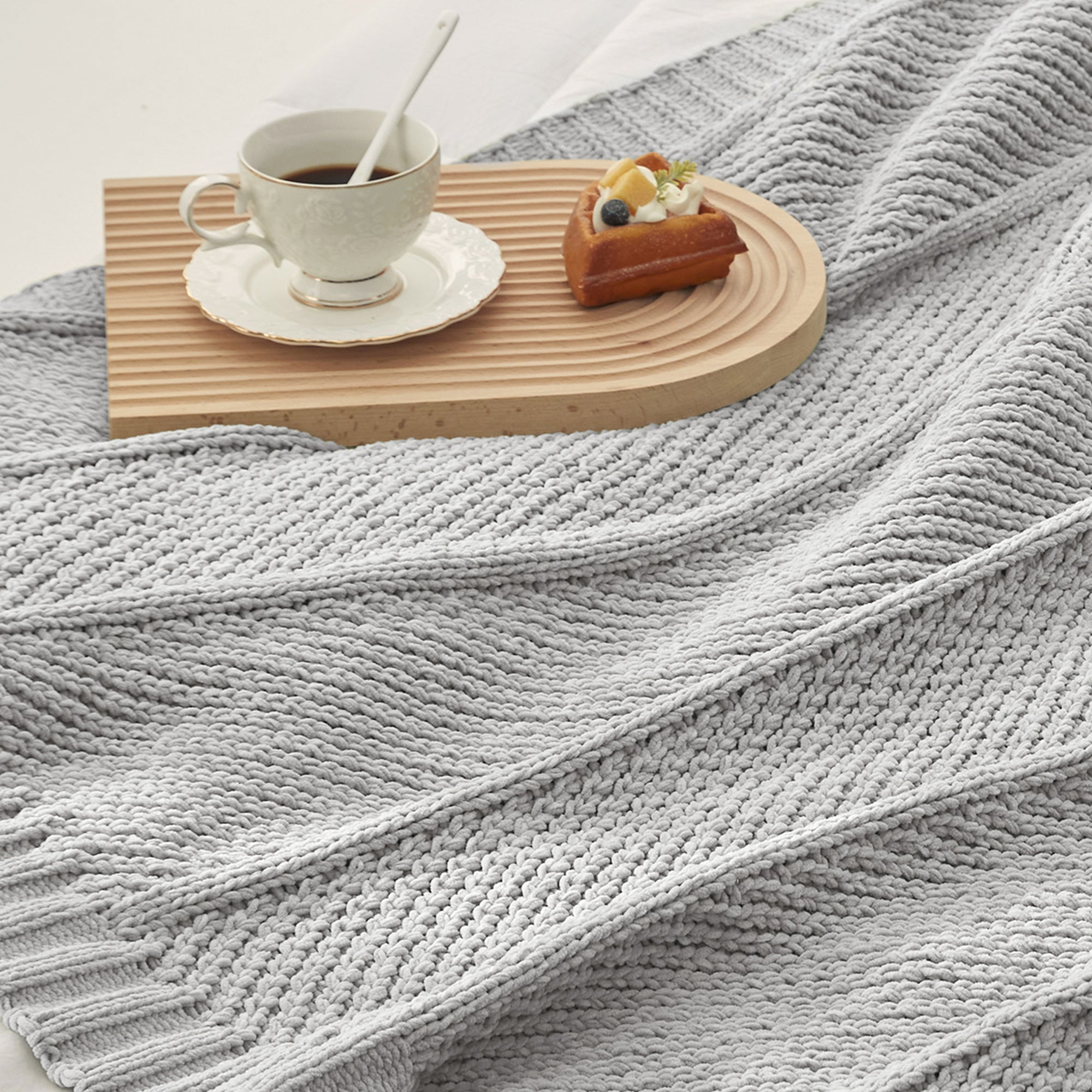 Close up of chevron chenille knit throw blanket  in Light Grey showing textured weave  #color_Light Grey