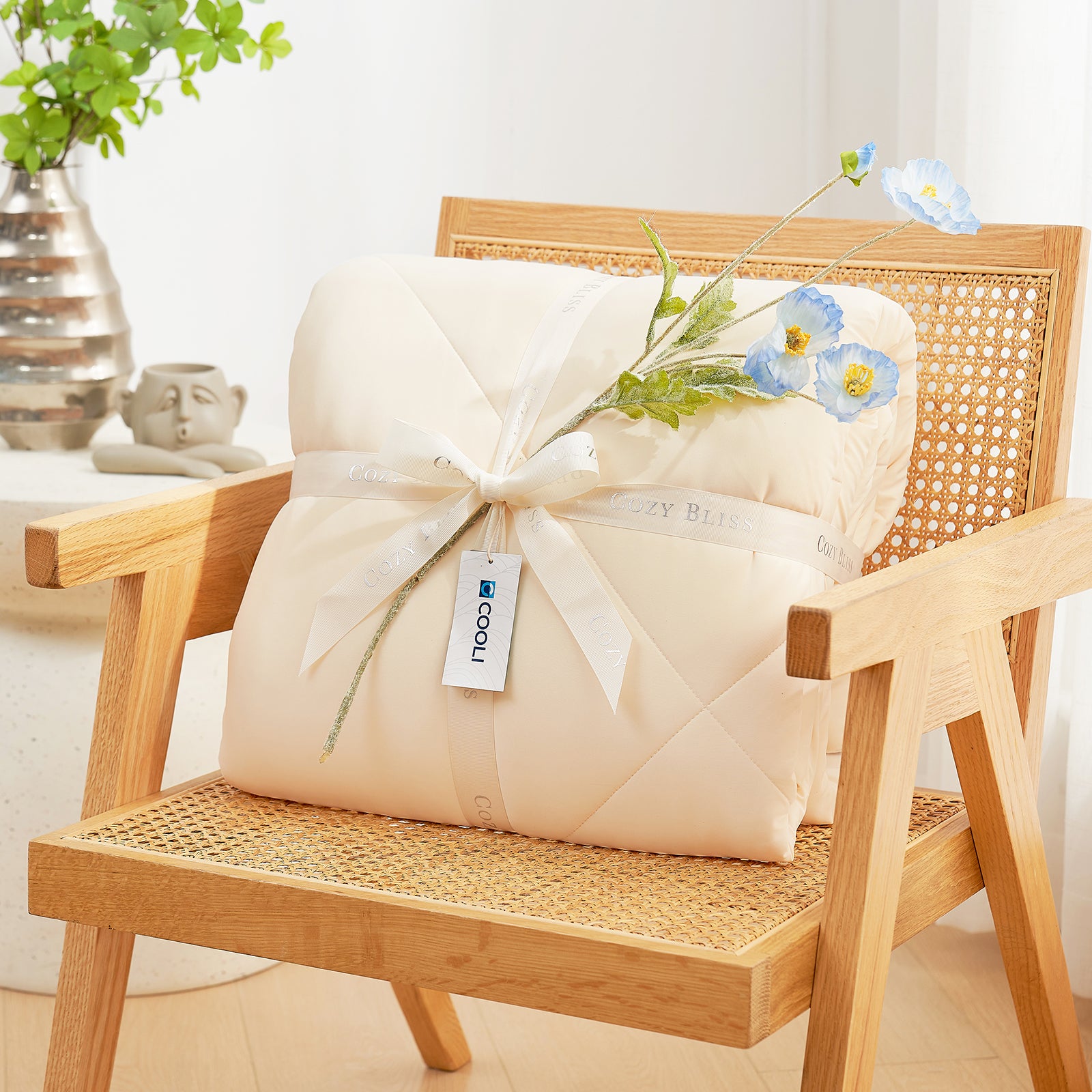 Cooling comforter with a white ribbon on a wooden chair, perfect as gift.#color_Yellow