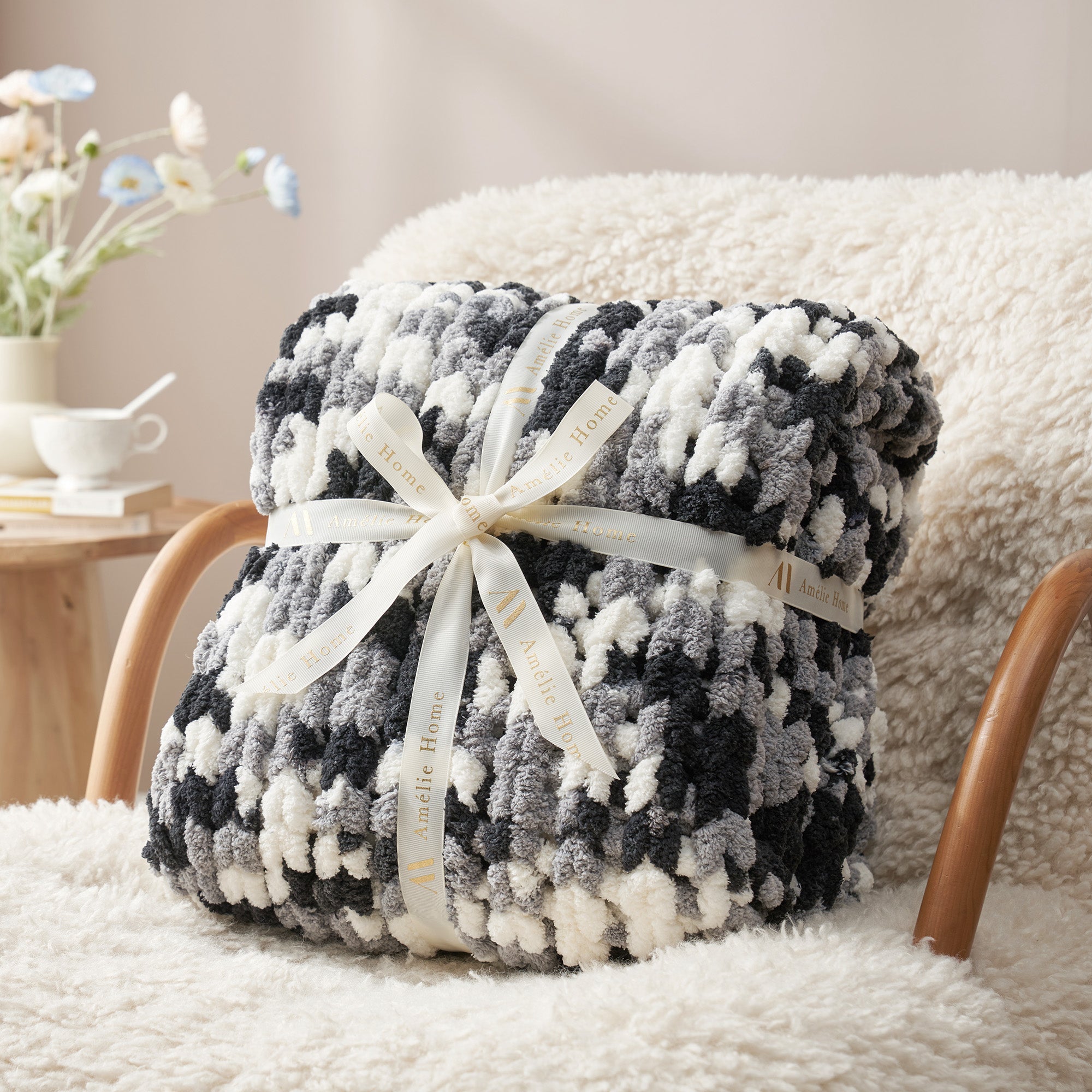 Handmade chunky chenille knit throw blanket in Black folded with ribbon perfect for gifting #color_Black