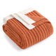 Folded burnt orange blanket with white trim on a white background #color_Burnt Orange