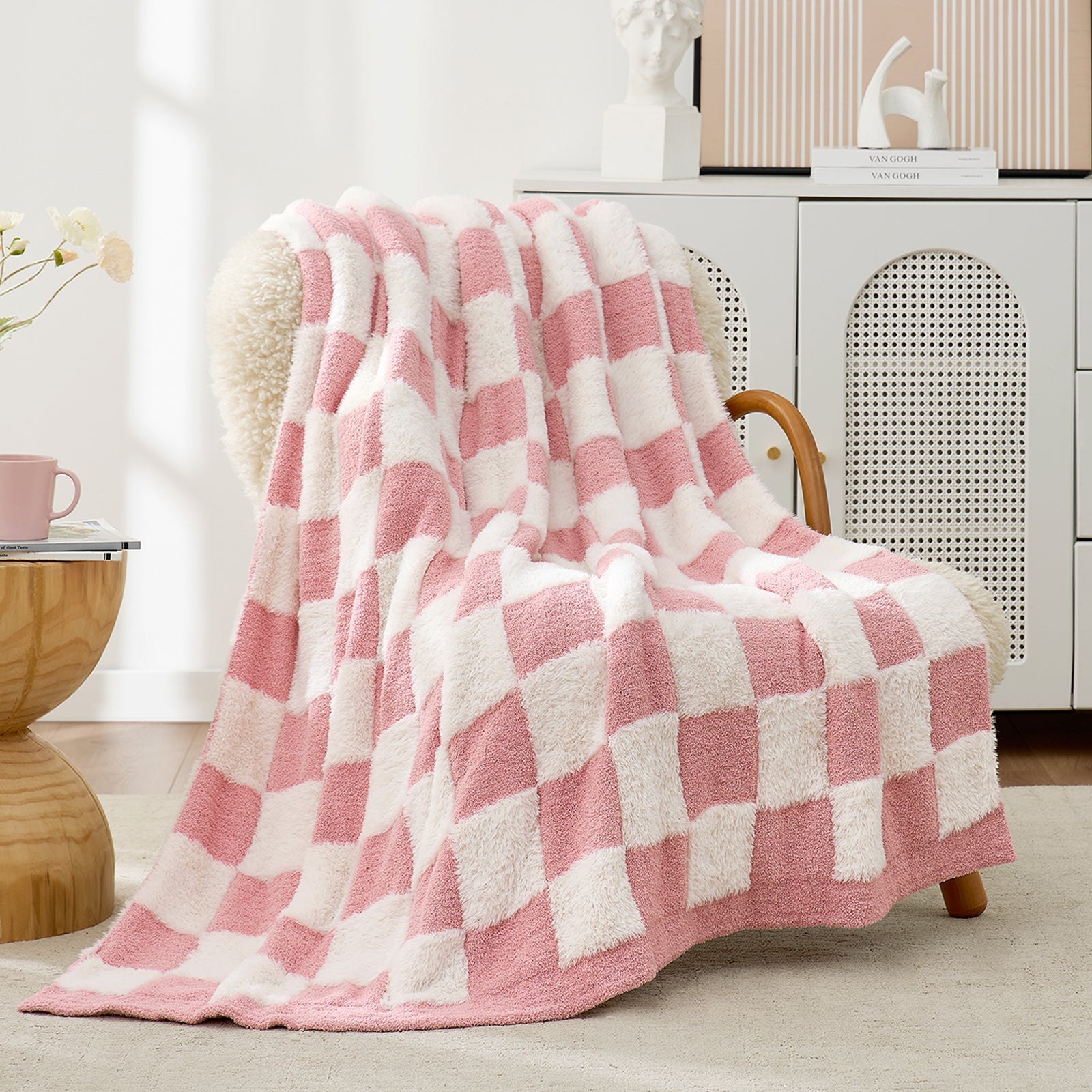 UltraCozy Checkered Feather Yarn Knit Throw Blanket on a beige chair#Color_Pink White
