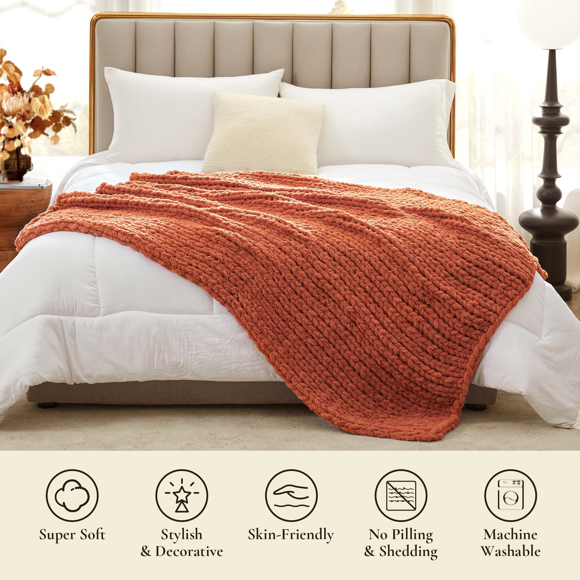 Soft chunky knit throw blanket in Burnt Orange layered on bed in a modern bedroom setting #color_Burnt Orange