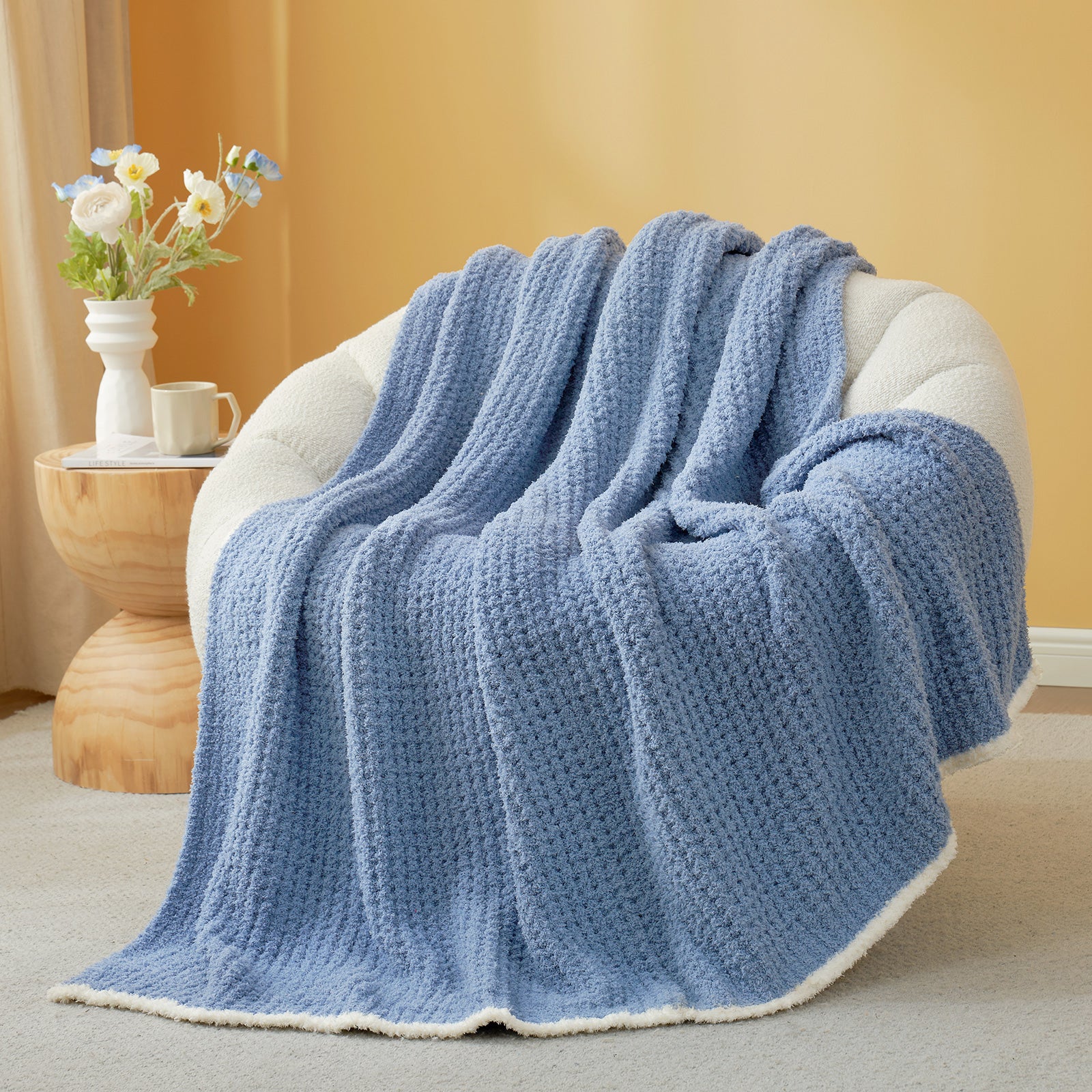  Soft Waffle Feather Yarn Knit Throw Blanket on a beige chair with vase of flower and mug#Color_Blue