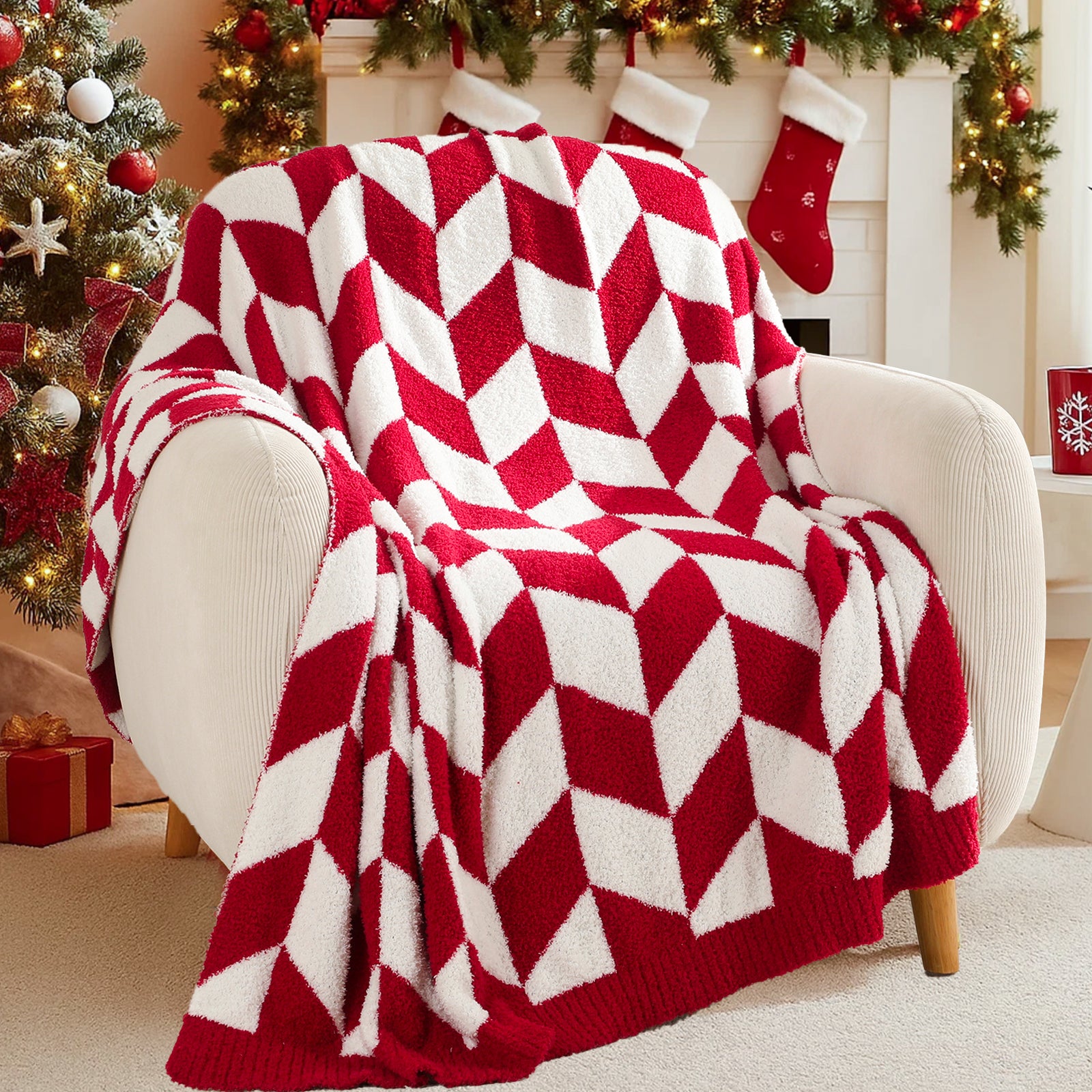 Red and white chevron patterned blanket draped over a chair in a festive living room with Christmas decorations.#color_Red/Cream