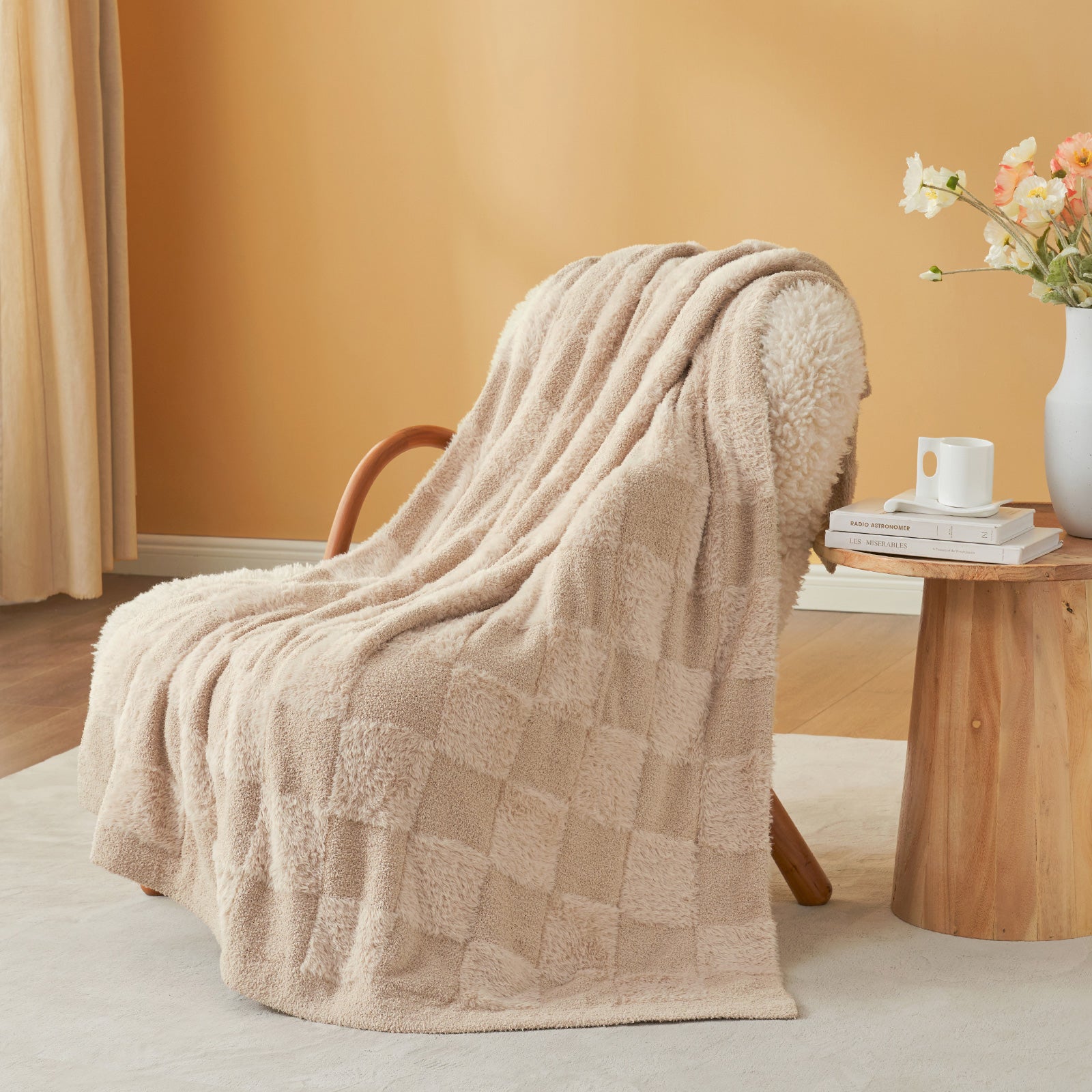 UltraCozy Solid Checkered Feather Yarn Knit Throw Blanket on a beige chair with candle and magazine - #Color_Solid Beige