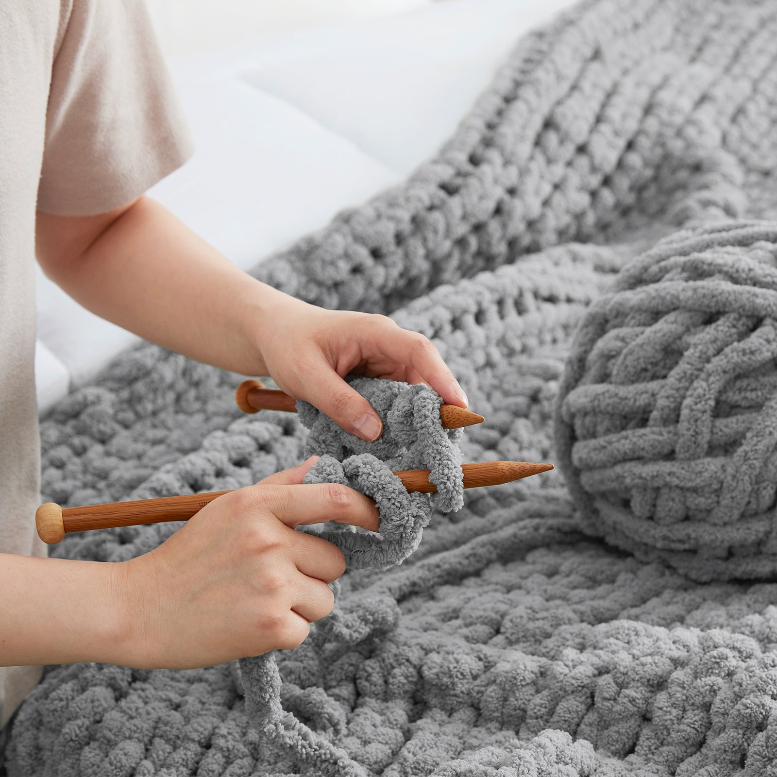Close up of chunky yarn knitting texture showing thick loops and softness #color_Light Grey