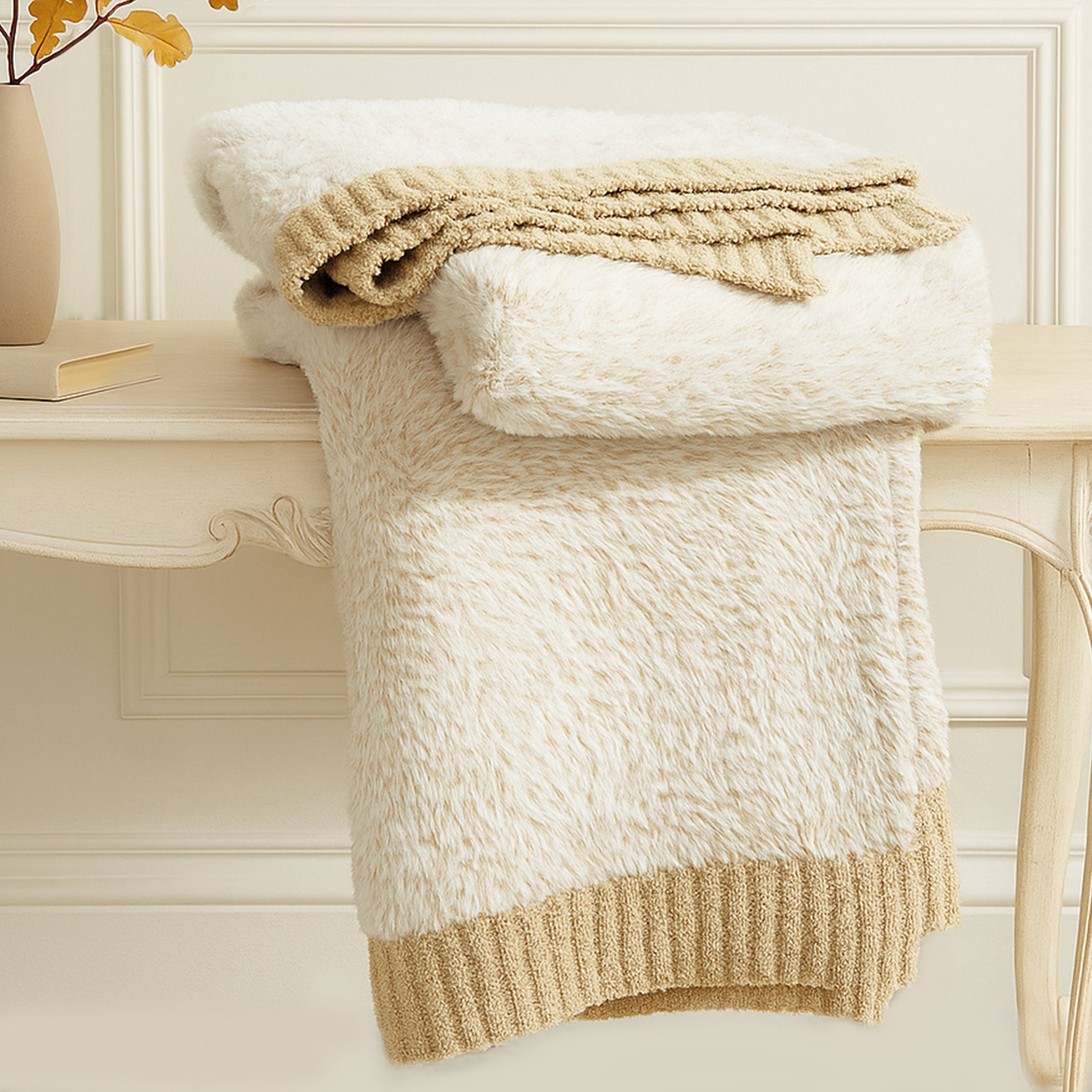 Ultrasoft faux fur knit throw blanket in Beige neatly folded on a wooden table, showcasing thick and plush texture #color_Beige