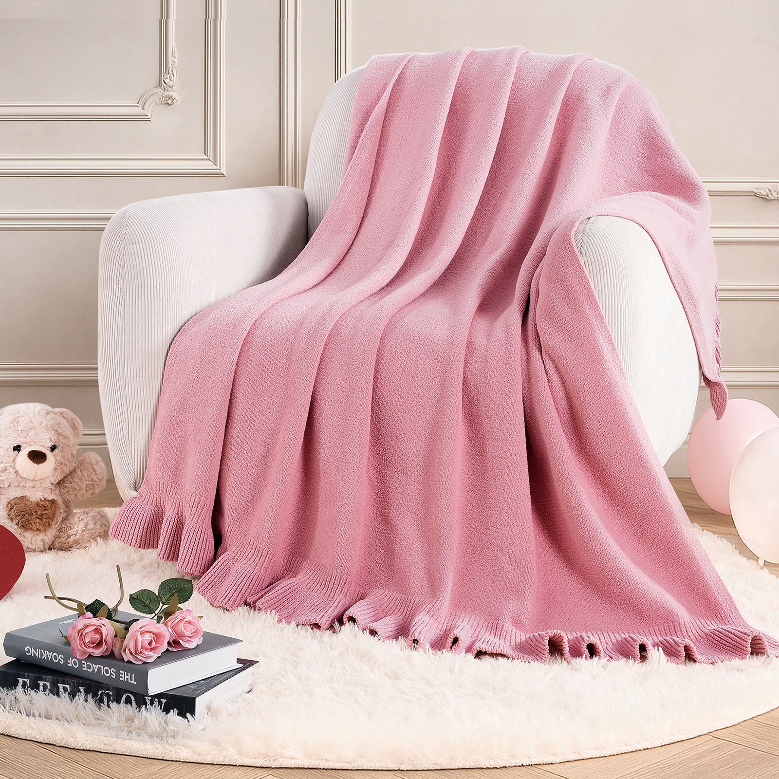 Ruffle chenille knit throw blanket in Pink draped over an armchair, creating a warm and inviting corner #color_Pink